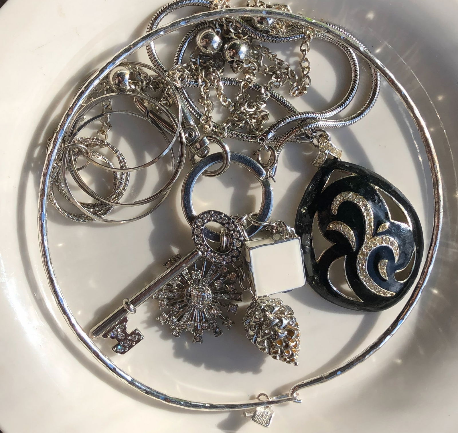 Silver Color Jewelry Set: A beautiful set of silver color jewelry including necklaces, bracelets, and rings.