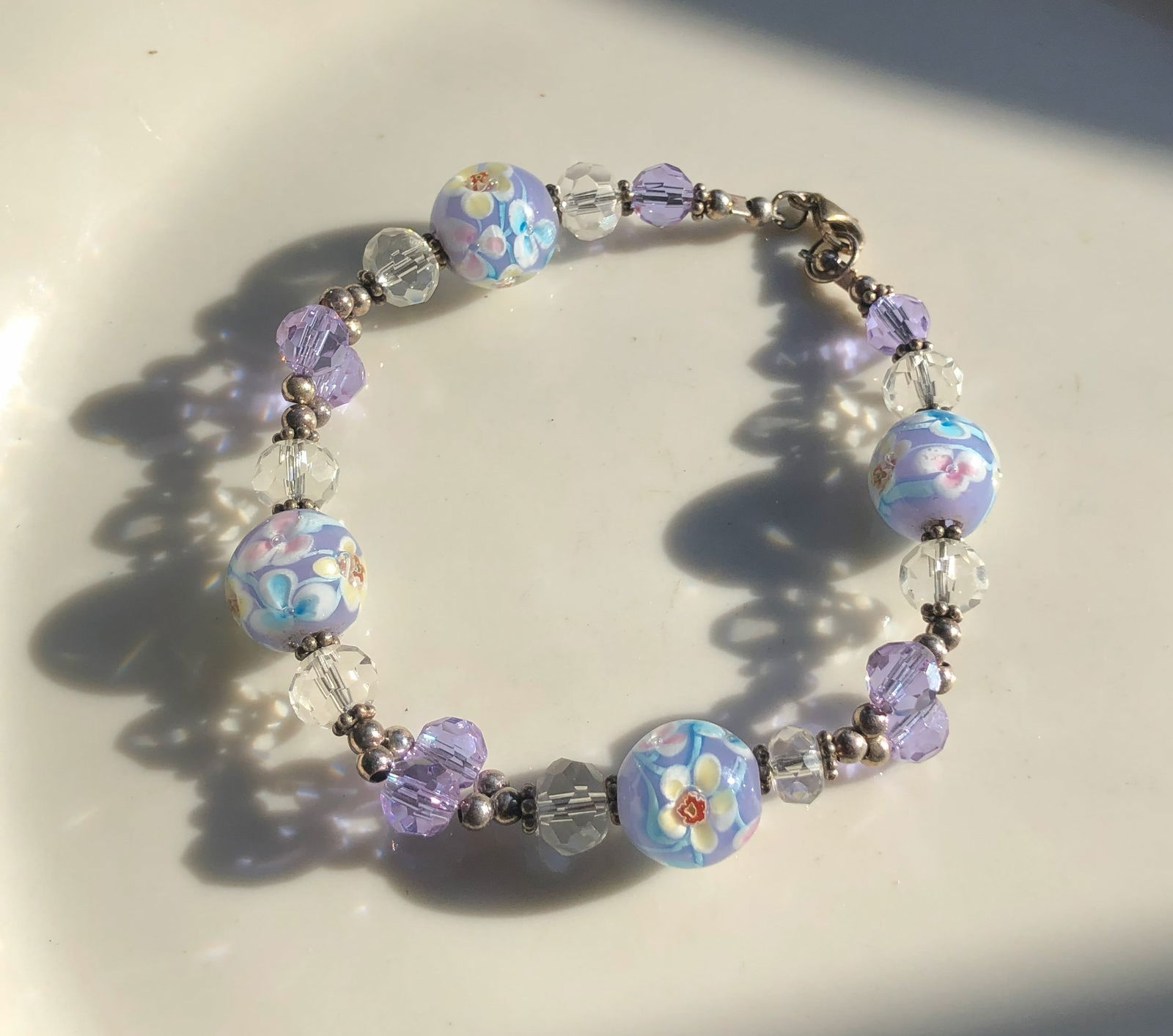 Floral Beaded Bracelet: A beautiful bracelet featuring floral beads and crystal accents.