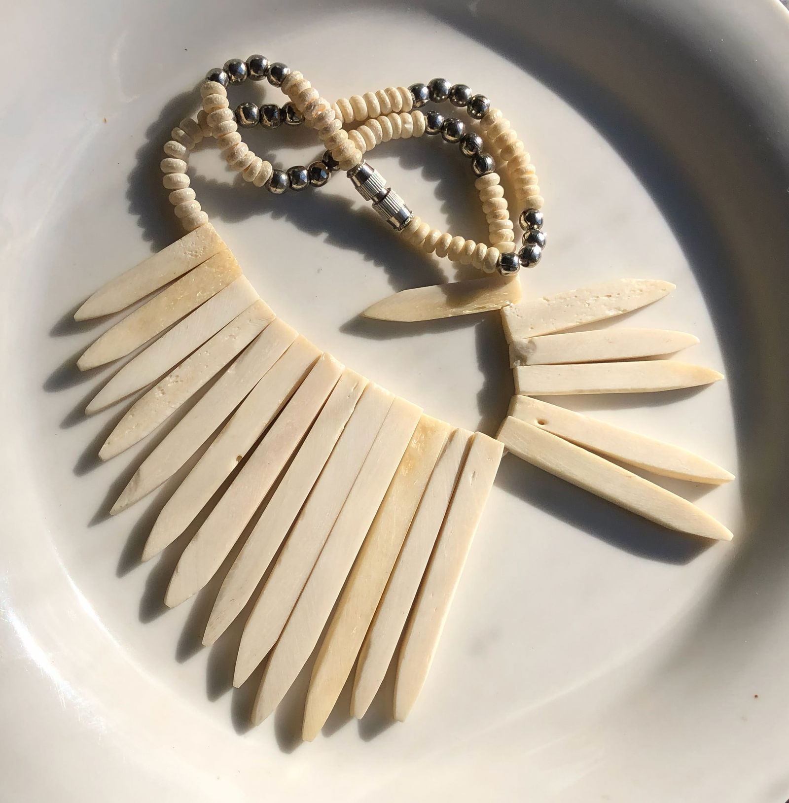 Bone Necklace: A handcrafted bone necklace with a unique design.