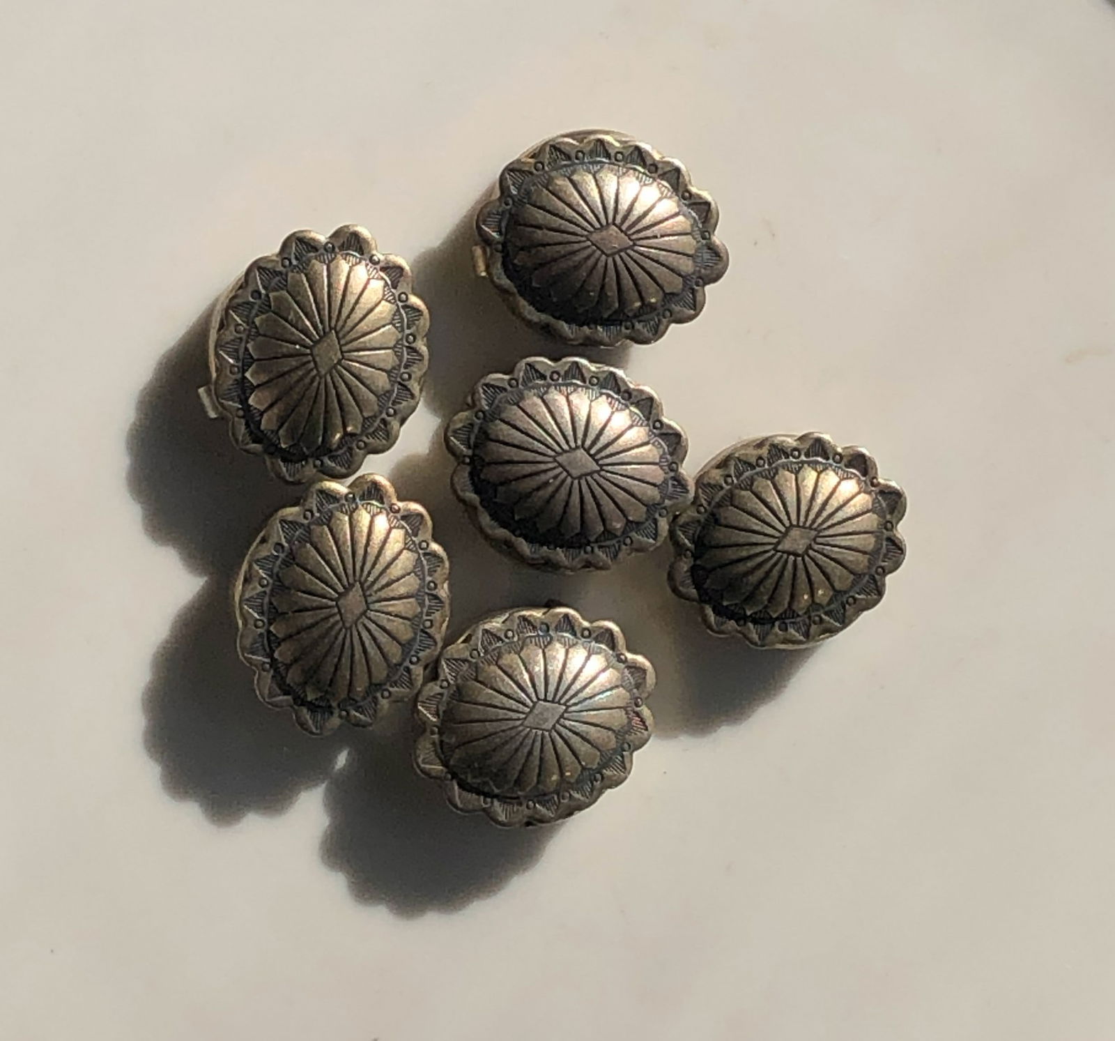 Decorative Silver Buttons: Set of 6 decorative Silver buttons with intricate design.