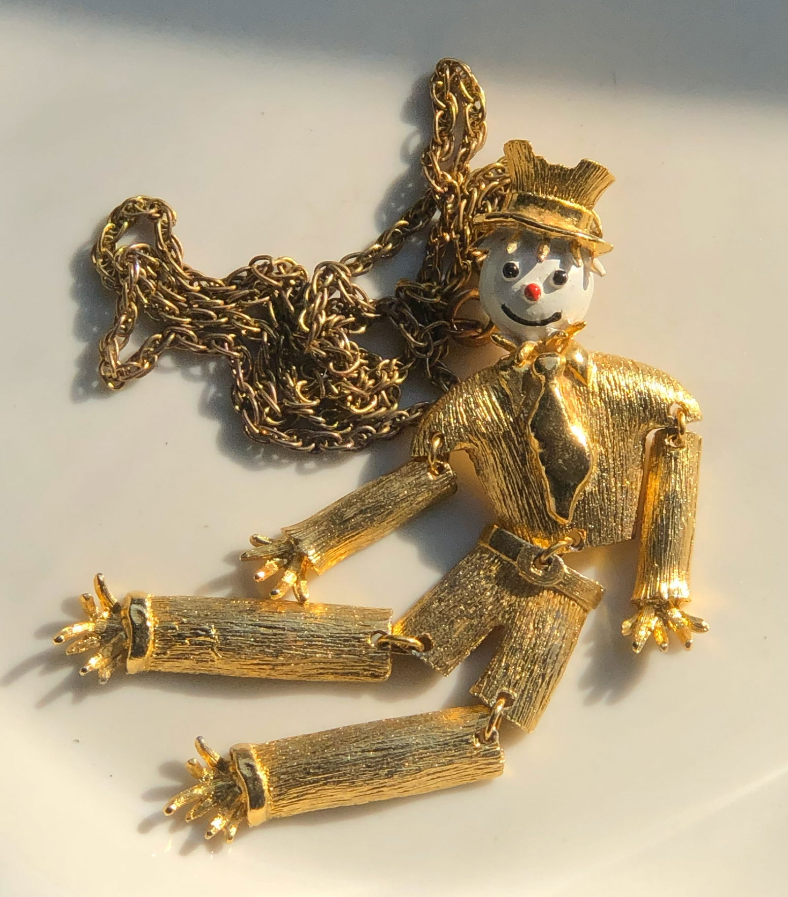 Gold Color Scarecrow Pendant Necklace: A charming gold Color scarecrow pendant necklace with articulated limbs and a playful design.