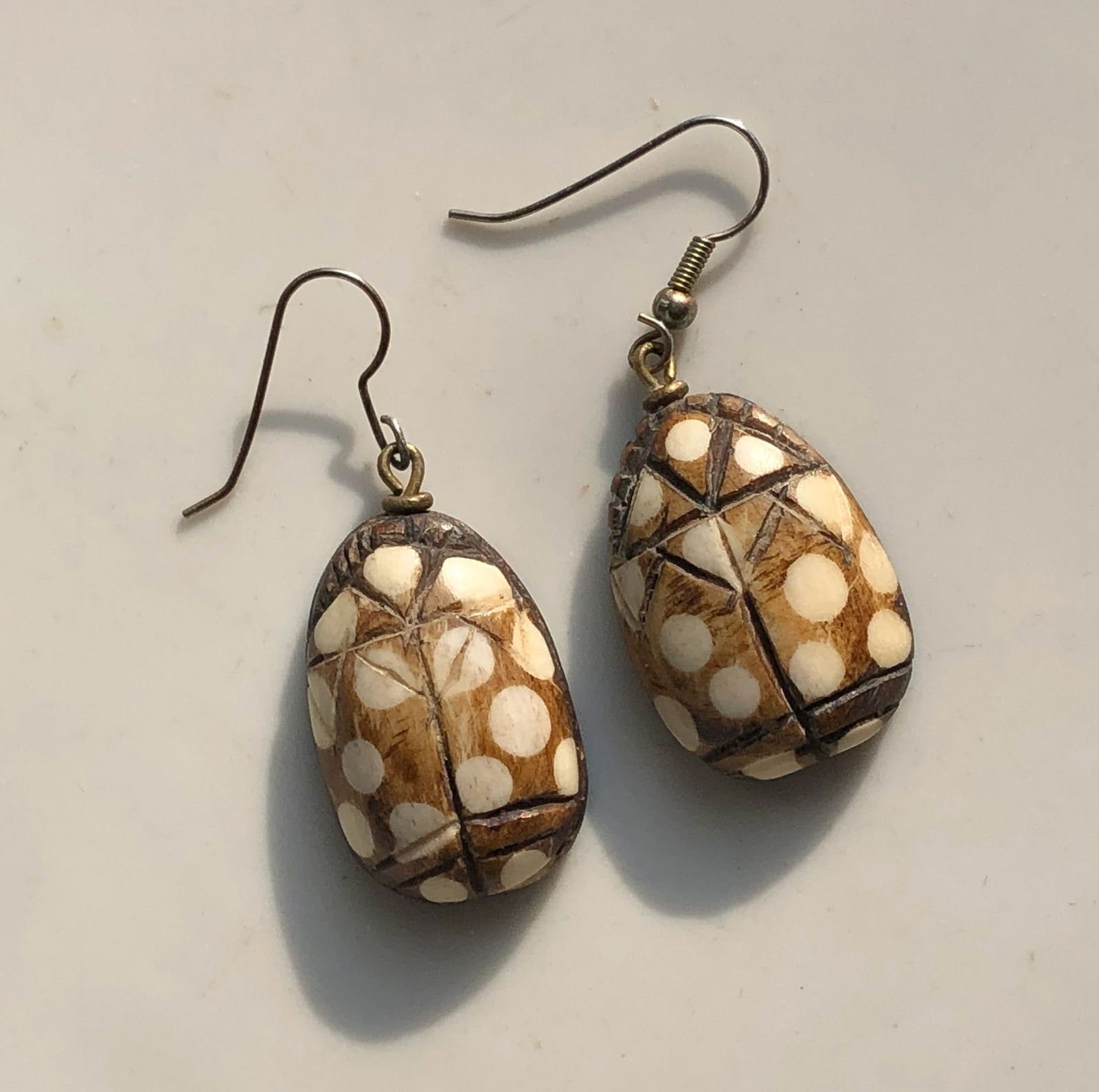 Polka Dot Bone Earrings: Handcrafted bone earrings with a polka dot design.