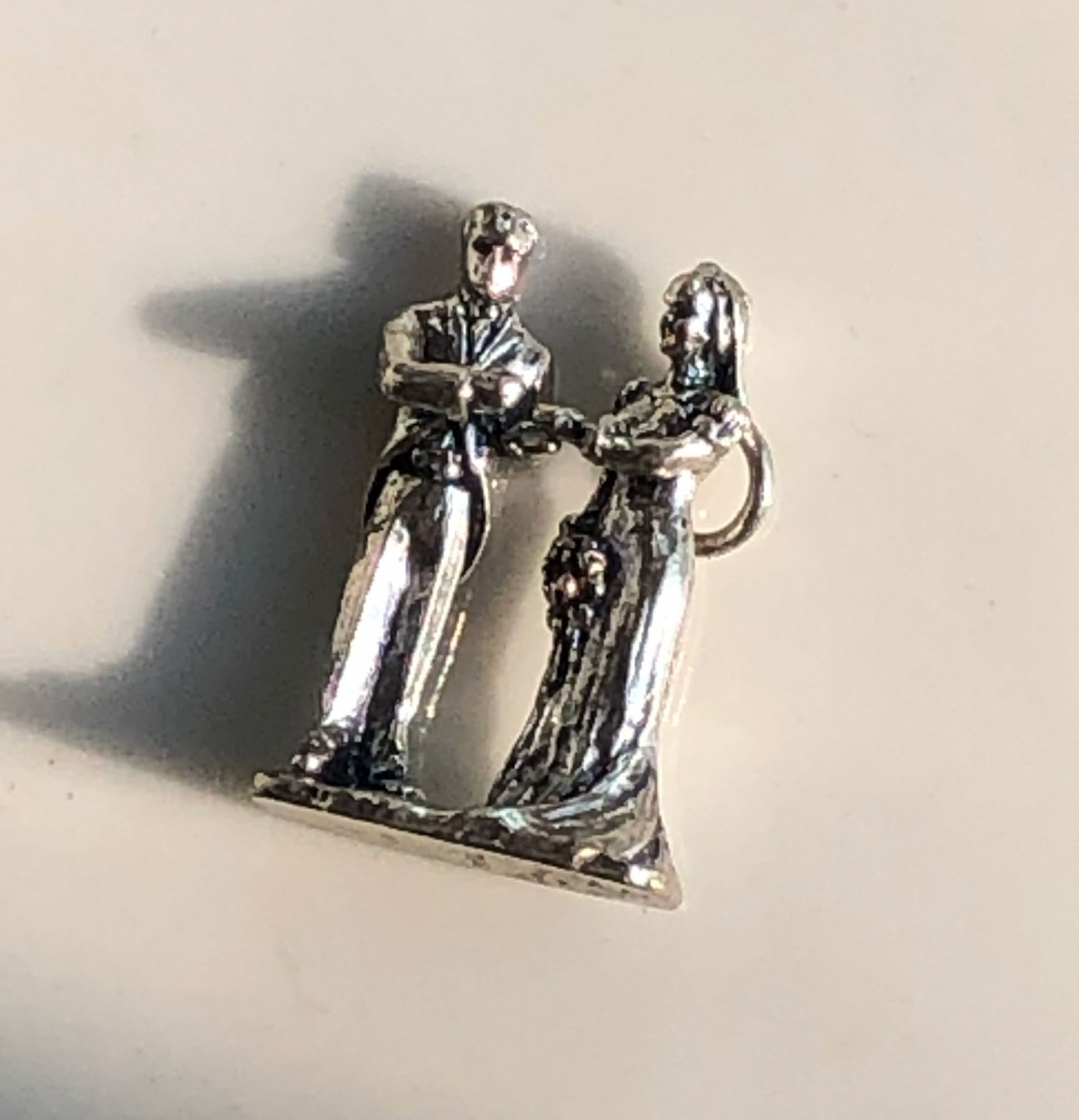 Vintage Silver Figurine: A unique vintage figurine with intricate details and a charming design. Size: 1"