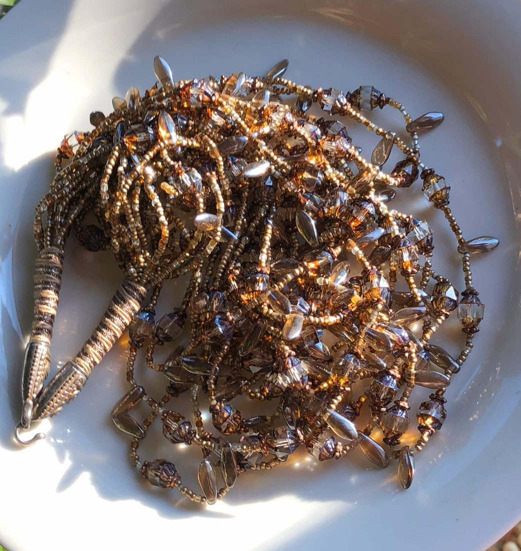 Beaded Necklace with Silver Clasp: A beautiful handcrafted beaded necklace with intricate details, Silver Clasp