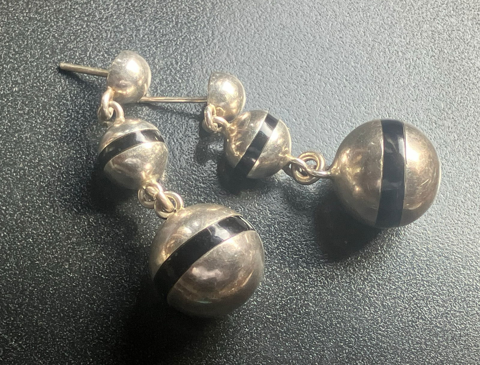 Silver and Black Striped Earrings: Elegant silver earrings with black stripes, perfect for any occasion.