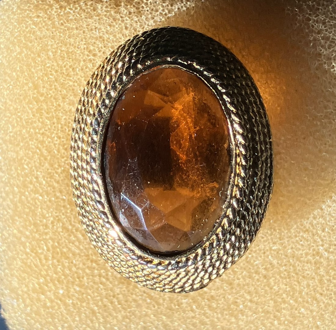 Vintage Glass Ring: A beautiful vintage ring featuring a large glass stone set in a textured metal band. Size 8.
