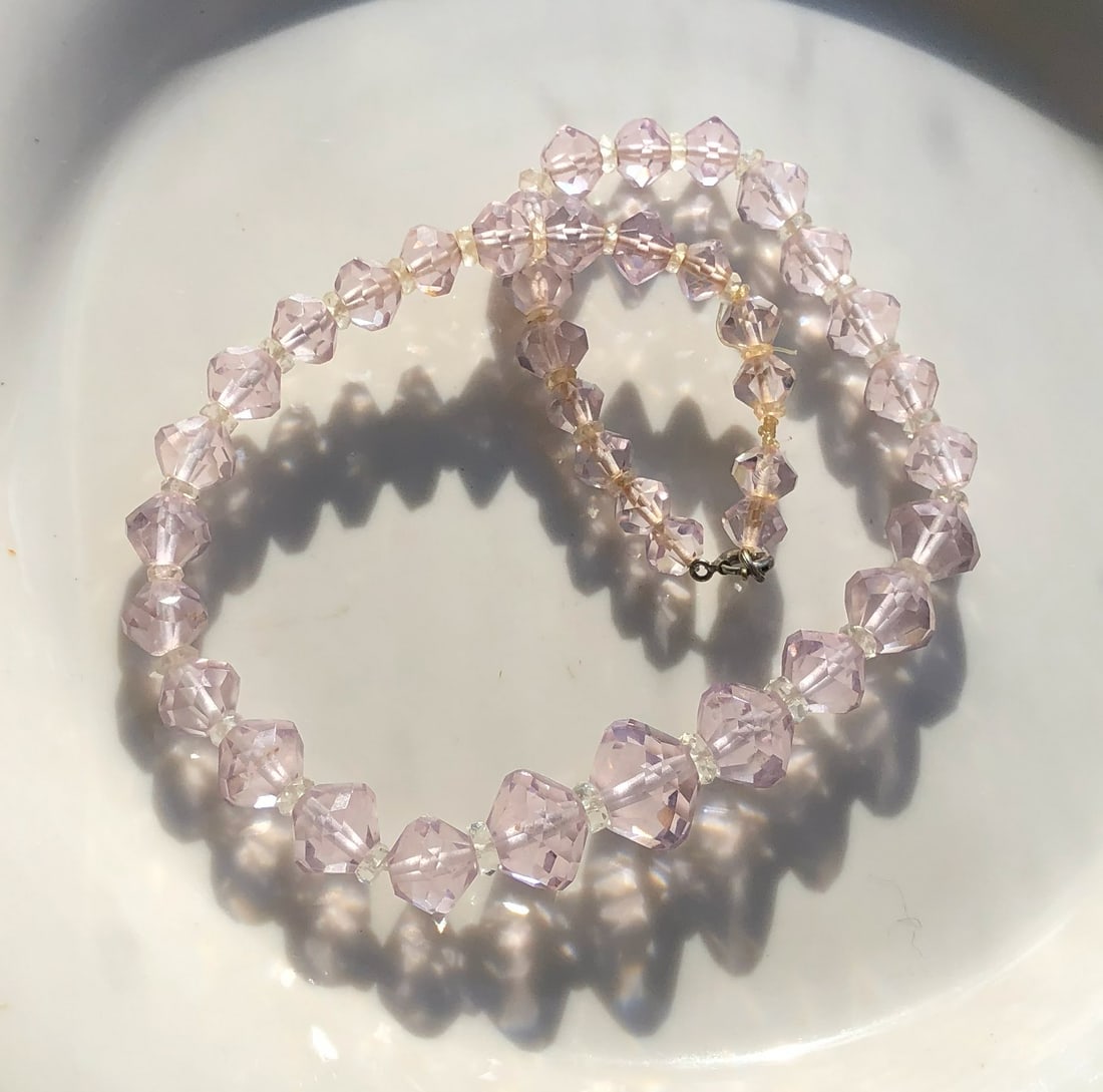 Crystal Bead Necklace: A beautiful crystal bead necklace with a delicate clasp.