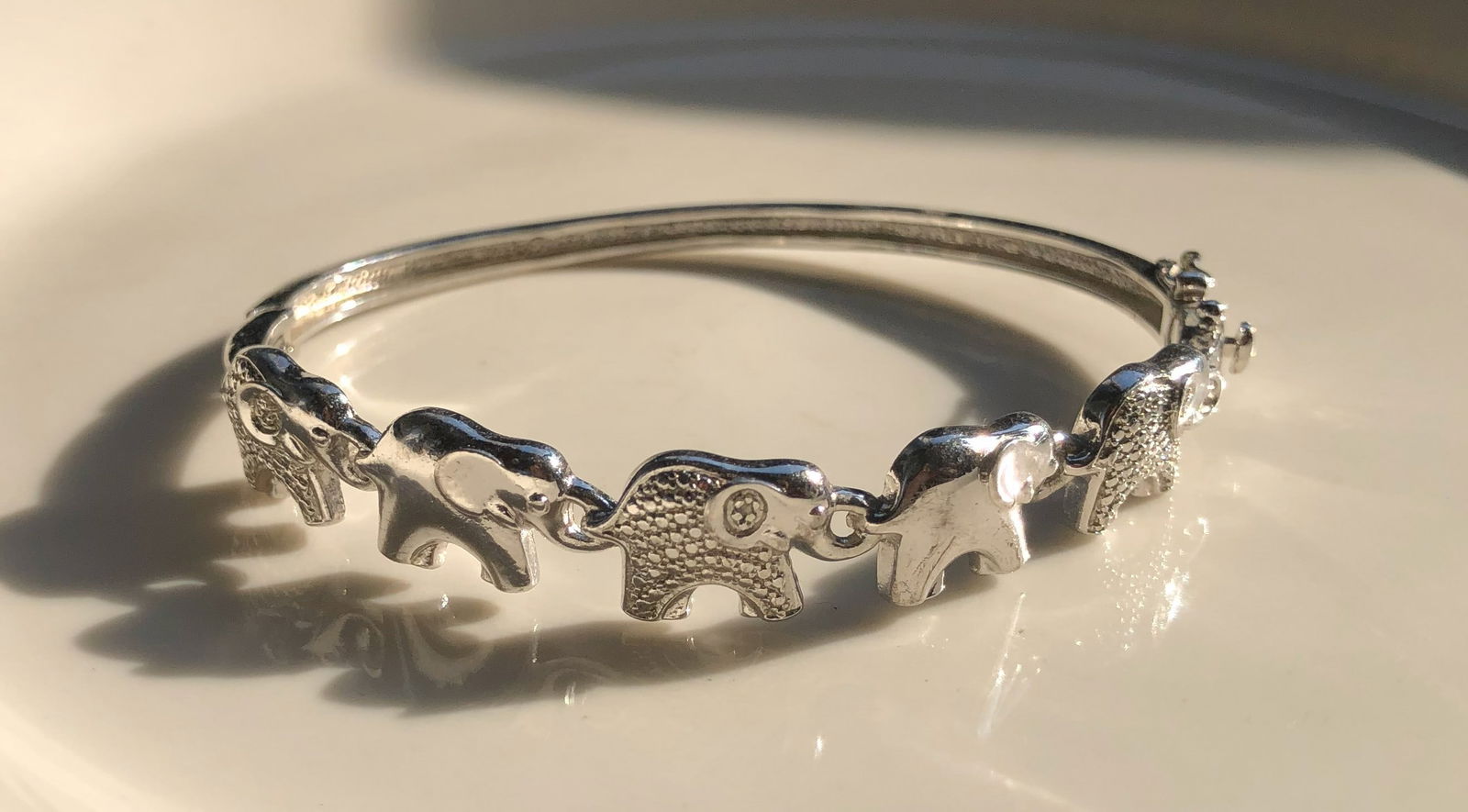 Elephant Bracelet: A beautiful silver bracelet featuring elephant charms.