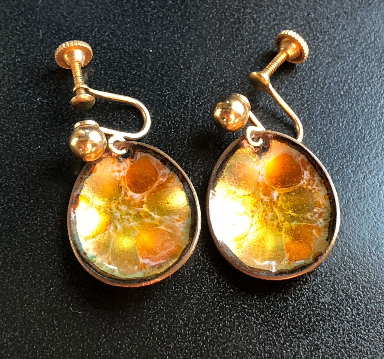Vintage Hogan Bolas Clip-On Earrings: Beautiful vintage Hogan Bolas clip-on earrings with a unique orange and gold design.