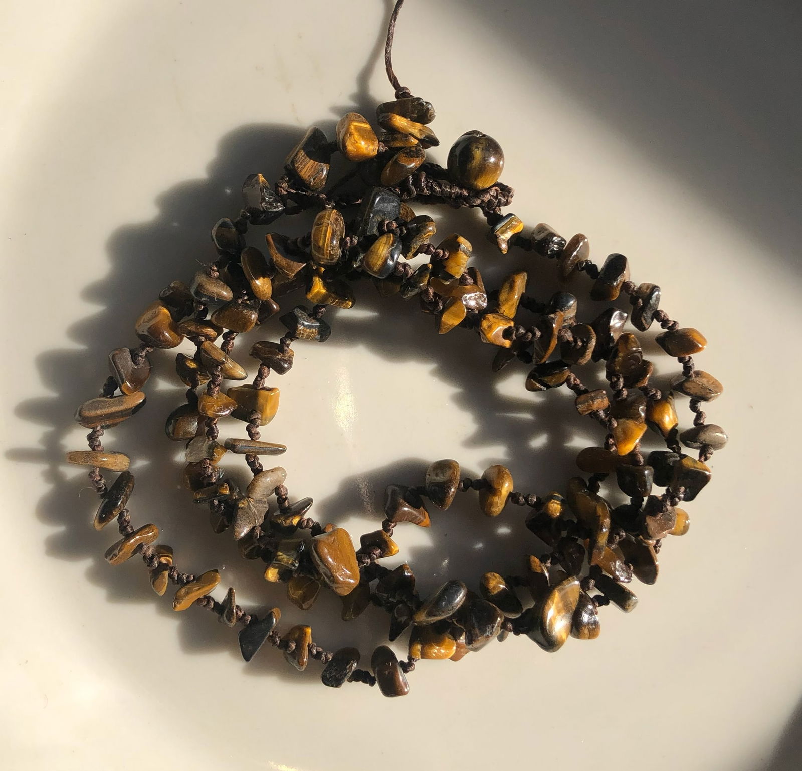 Tiger's Eye Stone Necklace: A beautiful necklace made with natural Tiger's Eye stones.