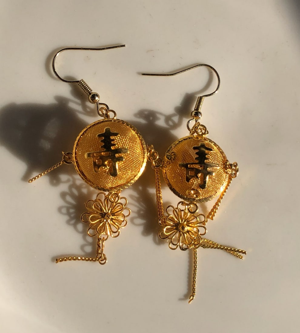 Gold Filled Earrings: Elegant gold filled earrings with intricate floral design.