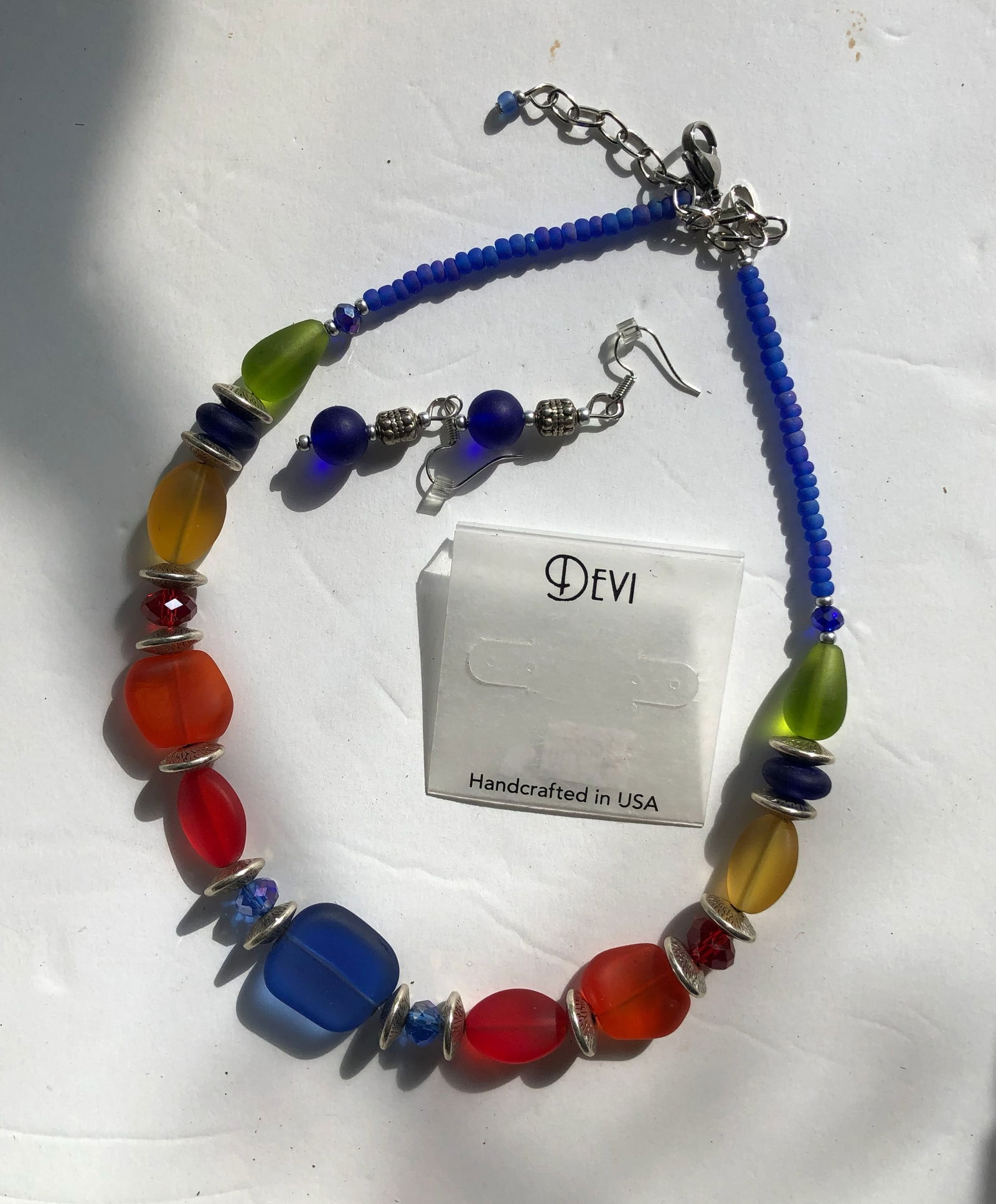 Handcrafted Necklace and Earrings Set: A vibrant handcrafted necklace and earrings set featuring colorful beads. Made in the USA.