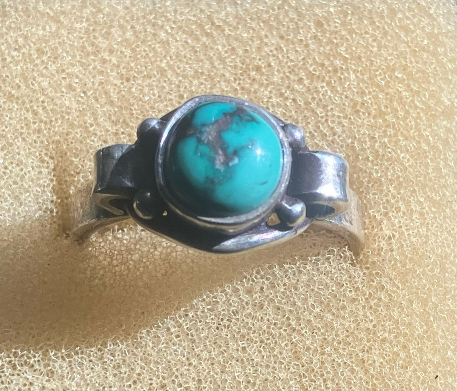 Turquoise Silver Ring: A beautiful silver ring featuring a turquoise stone. Size 7.