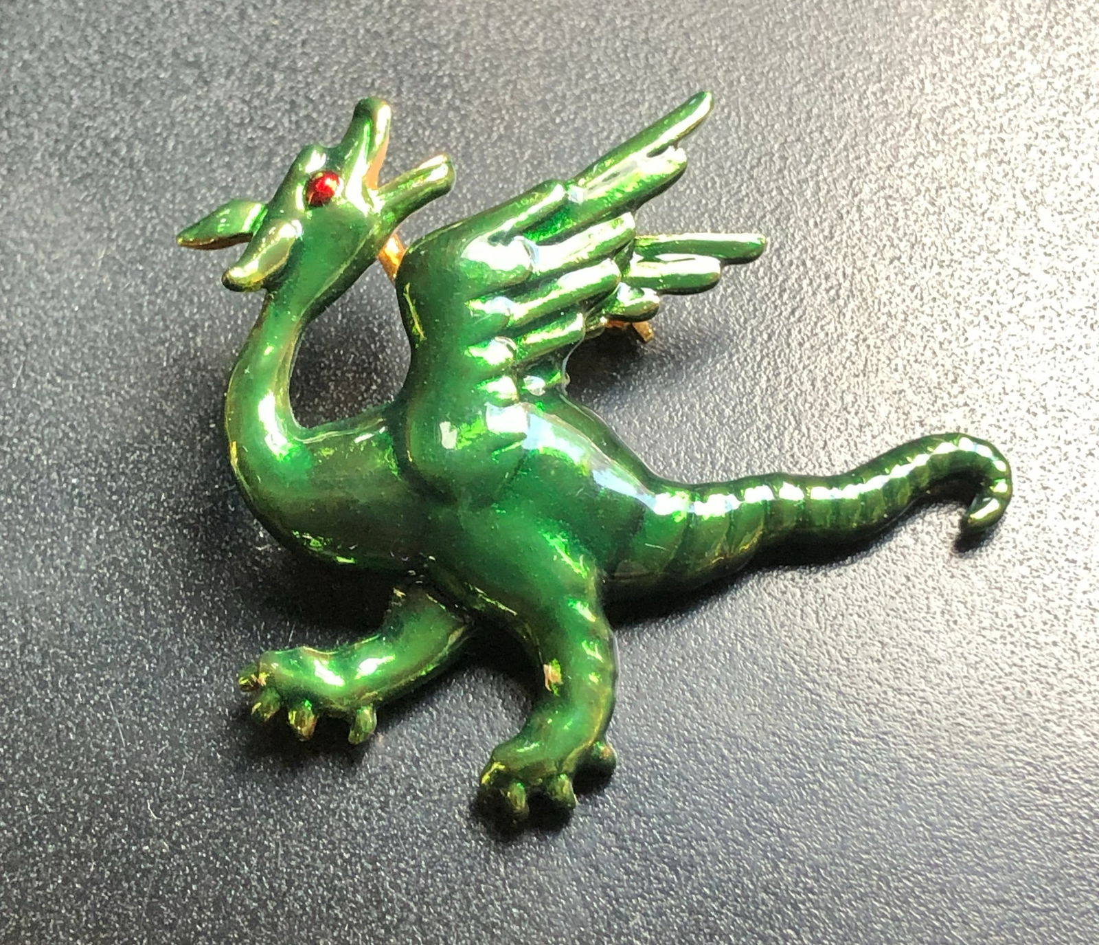 Green Dragon Silver Brooch: A shiny green dragon silver brooch with intricate details and a red eye.Size: 2"