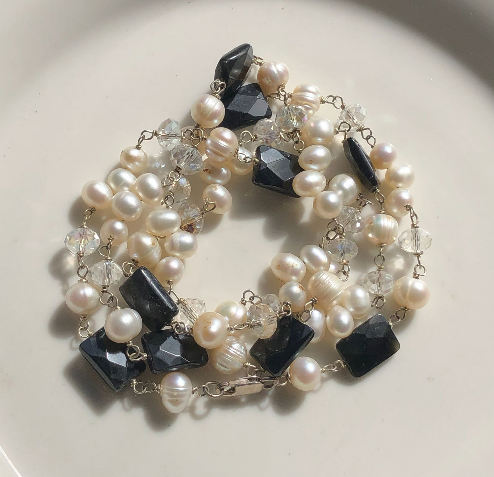 Pearl and Black Stone Necklace: Elegant necklace featuring pearls and black stones, perfect for any occasion.