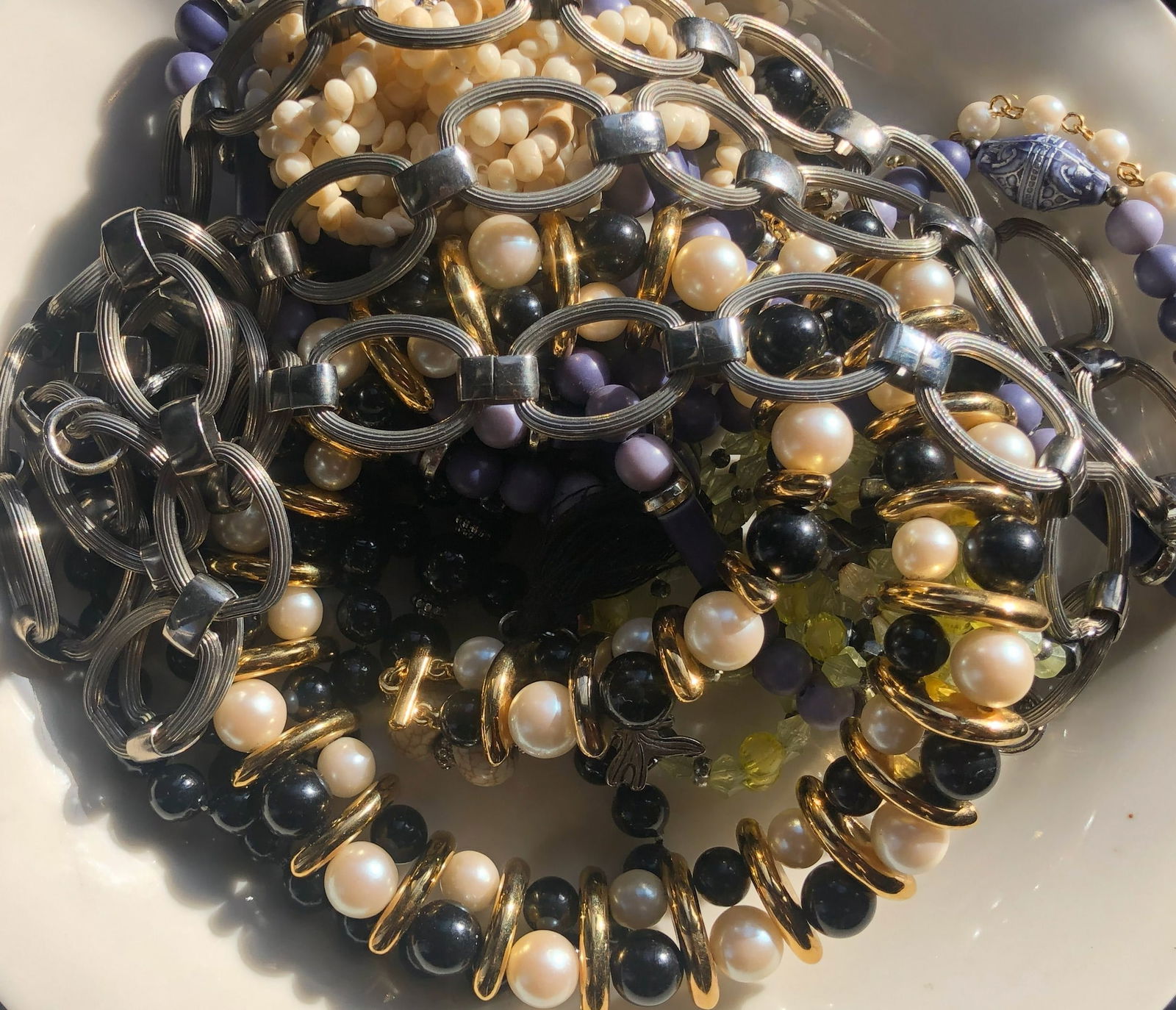 Assorted Jewelry Set: A beautiful assortment of jewelry including bracelets and necklaces with pearls and beads.