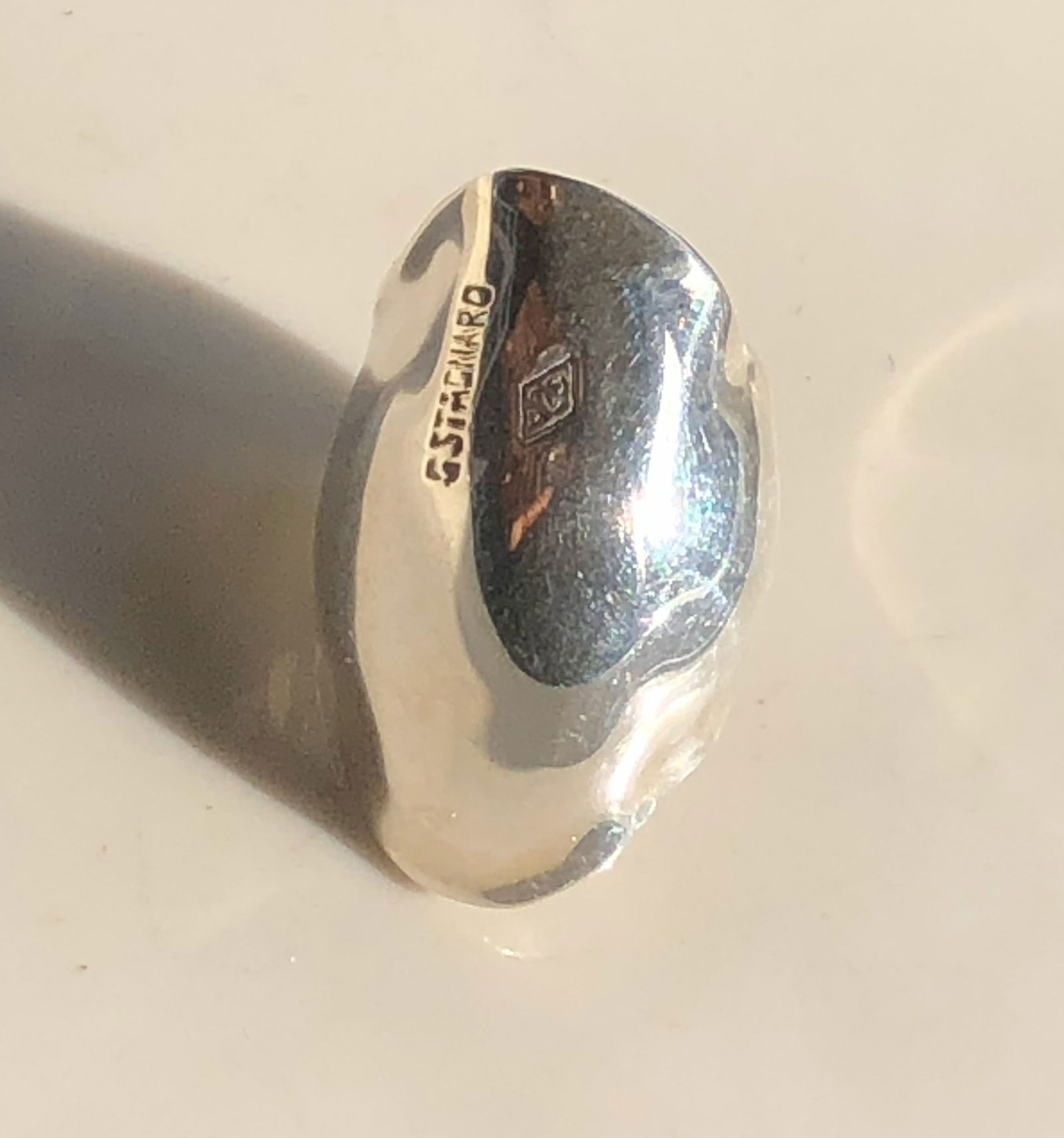 Silver Ring: A stylish silver ring with a unique design. Size adjustable.