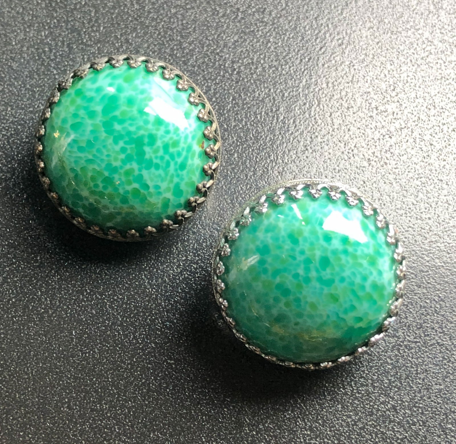 Vintage Earrings: Beautiful earrings with intricate silver detailing.