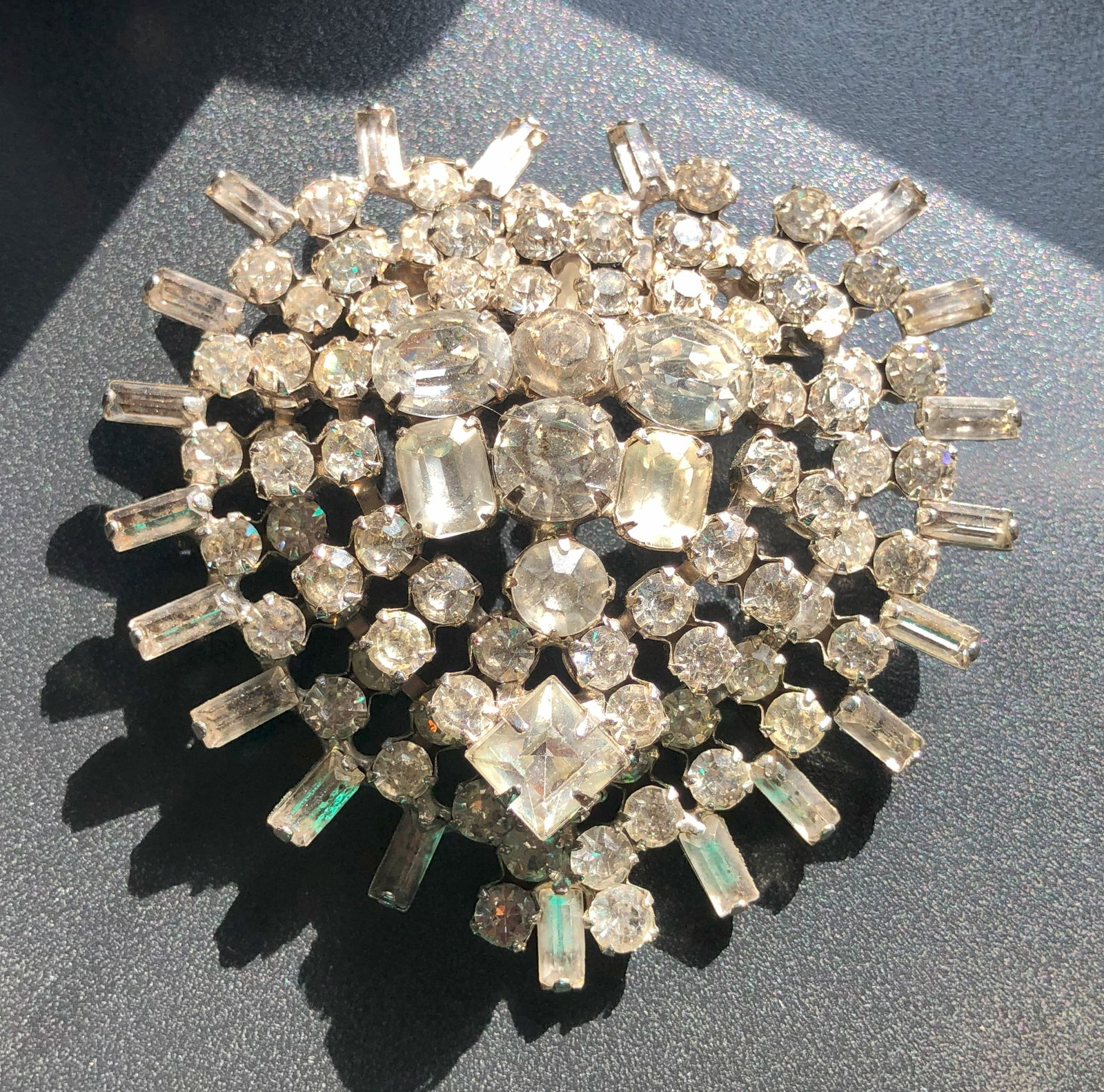 Vintage Rhinestone Brooch: A stunning vintage rhinestone brooch with intricate detailing.