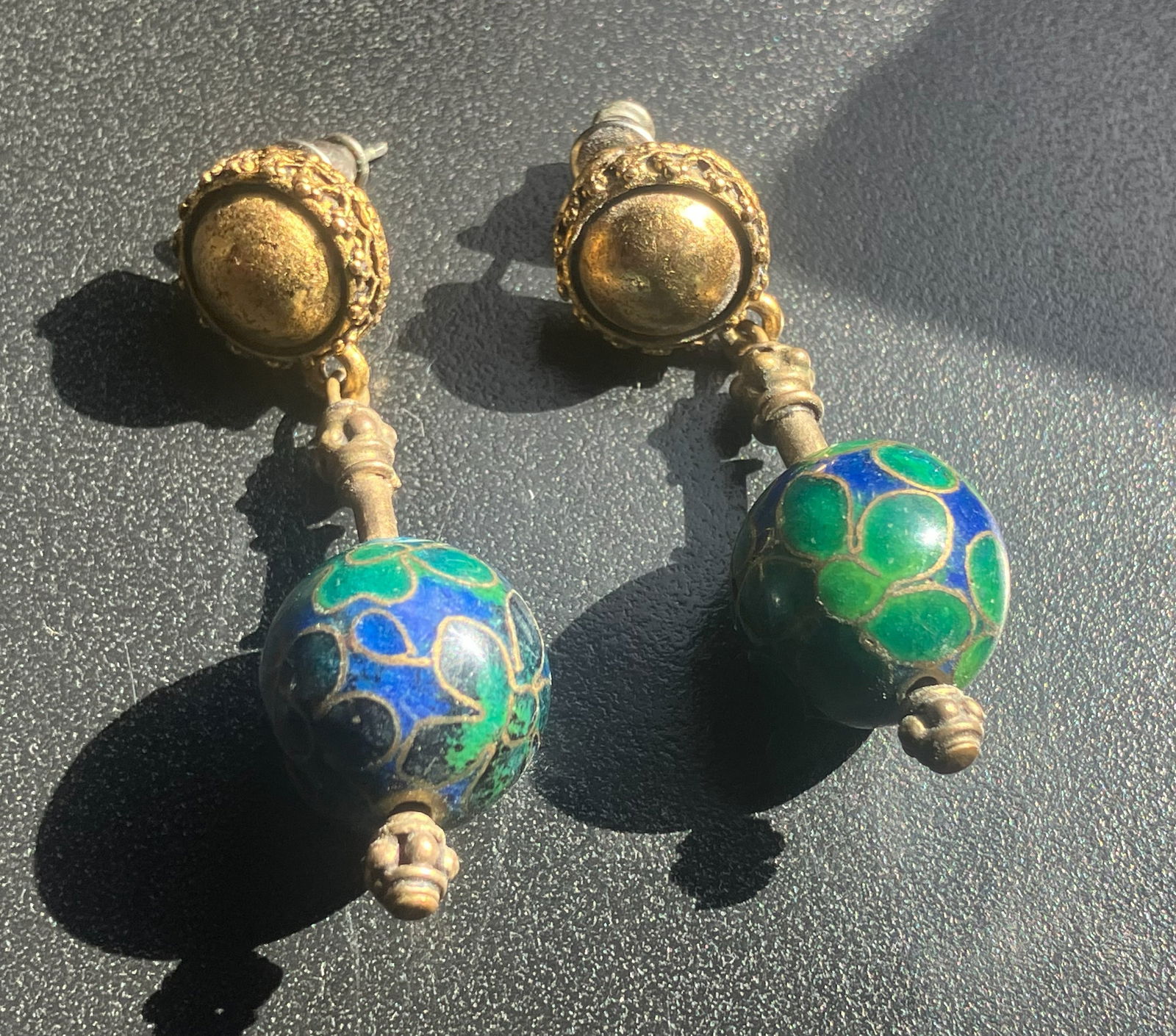 Vintage Earrings: Elegant vintage earrings with intricate design and colorful beads.