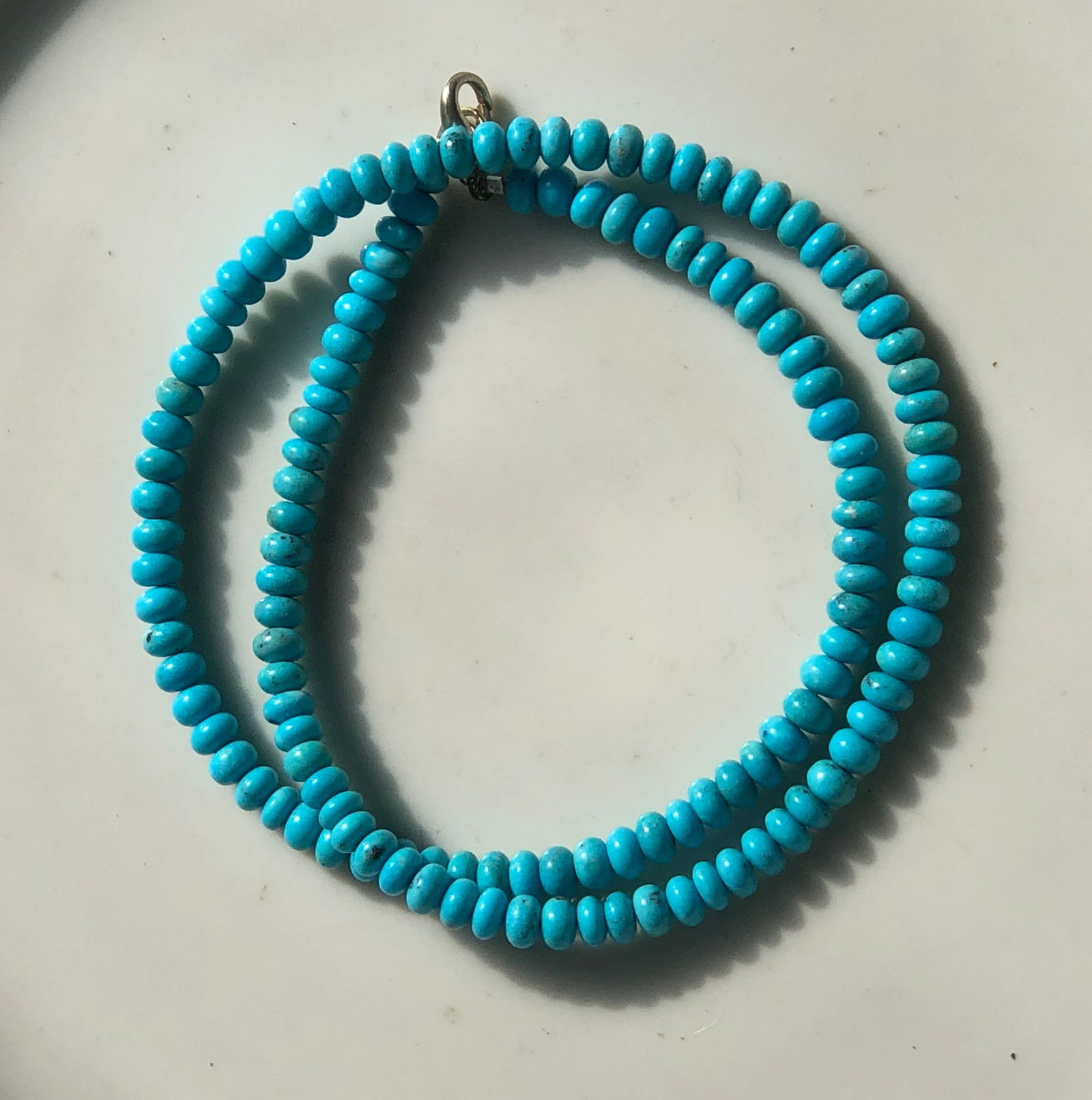 Turquoise Beaded Necklace: A beautiful turquoise beaded necklace, perfect for any occasion.