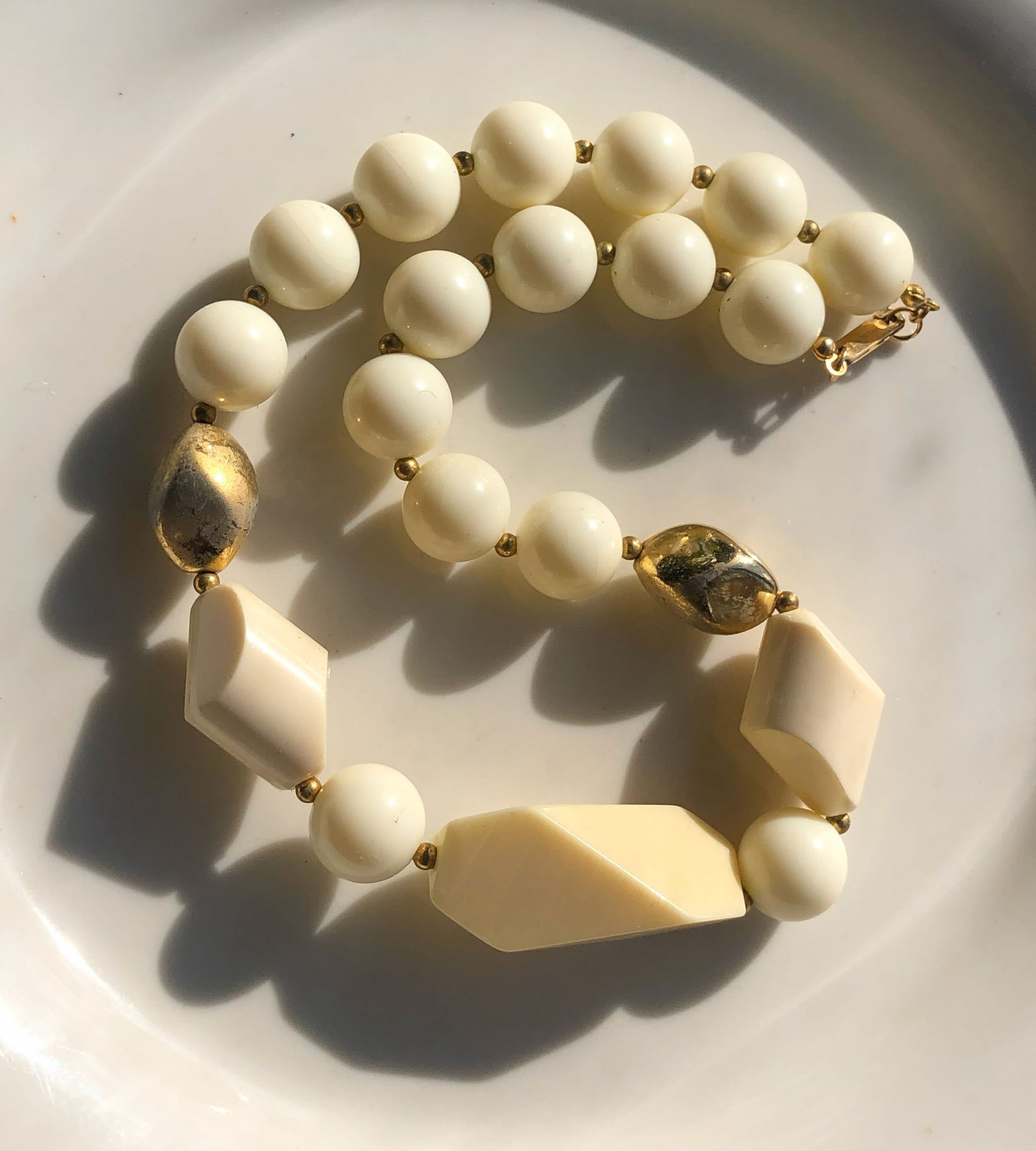 Elegant Bead Necklace: Elegant bead necklace with gold accents.