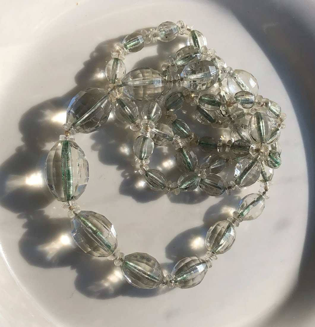 Crystal Bead Necklace: A beautiful crystal bead necklace with a delicate clasp.