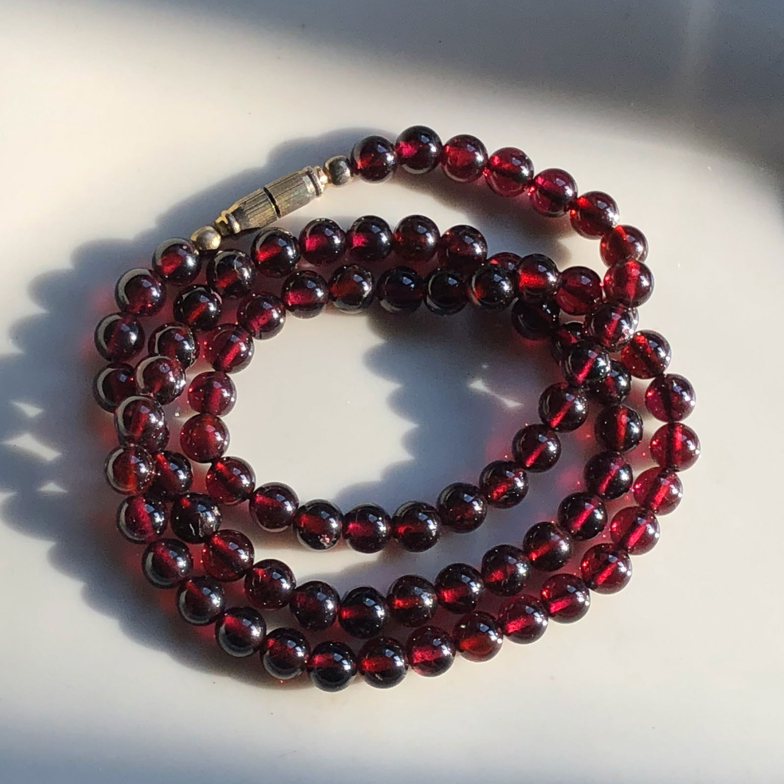 Garnet Bead Necklace: Elegant garnet bead necklace with a classic clasp.