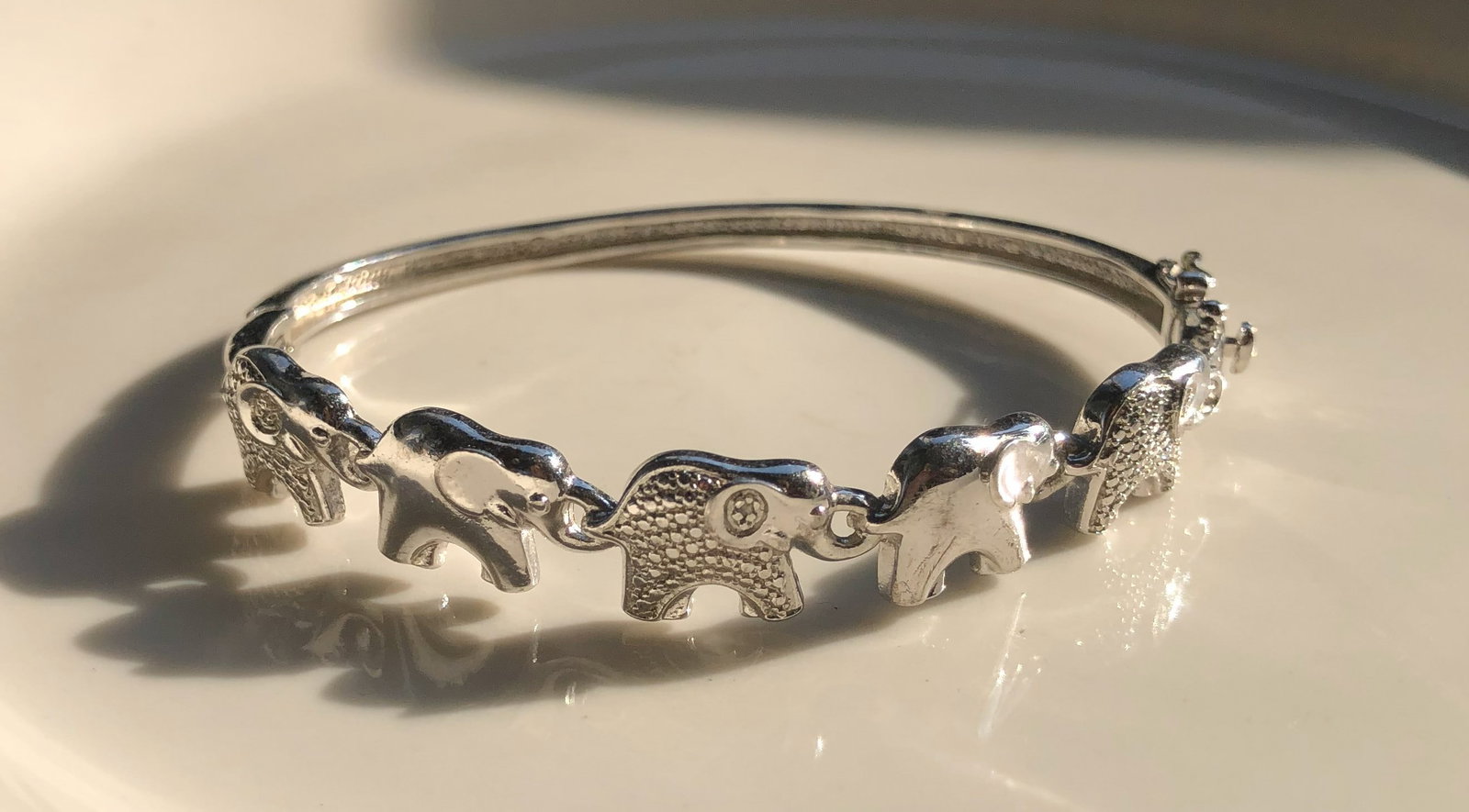 Elephant Bracelet: A beautiful silver bracelet featuring elephant charms.