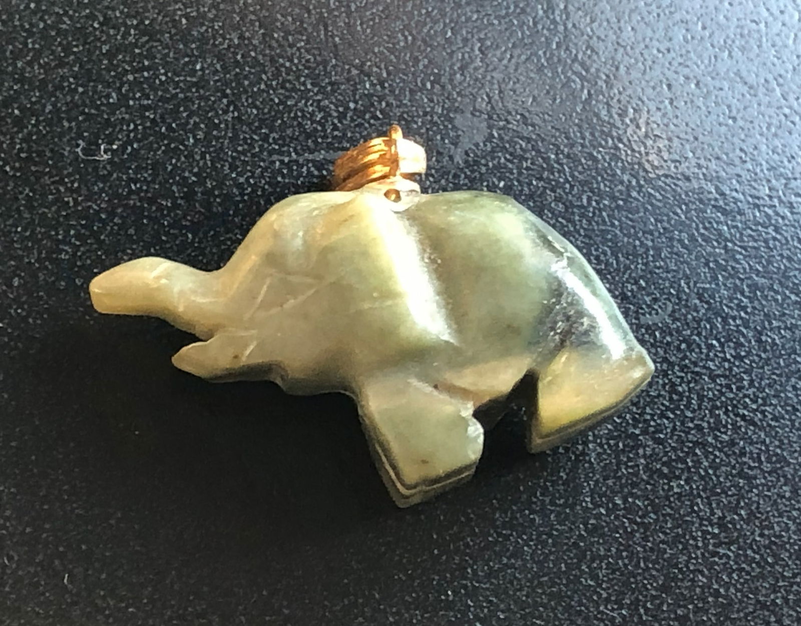 Green Jade Elephant Pendant: A beautifully crafted Green Jade elephant pendant made from polished stone.