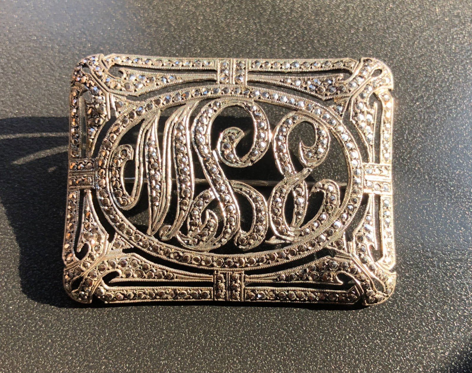 Vintage Silver Brooch: A beautifully crafted silver brooch with intricate detailing. Size: 2".