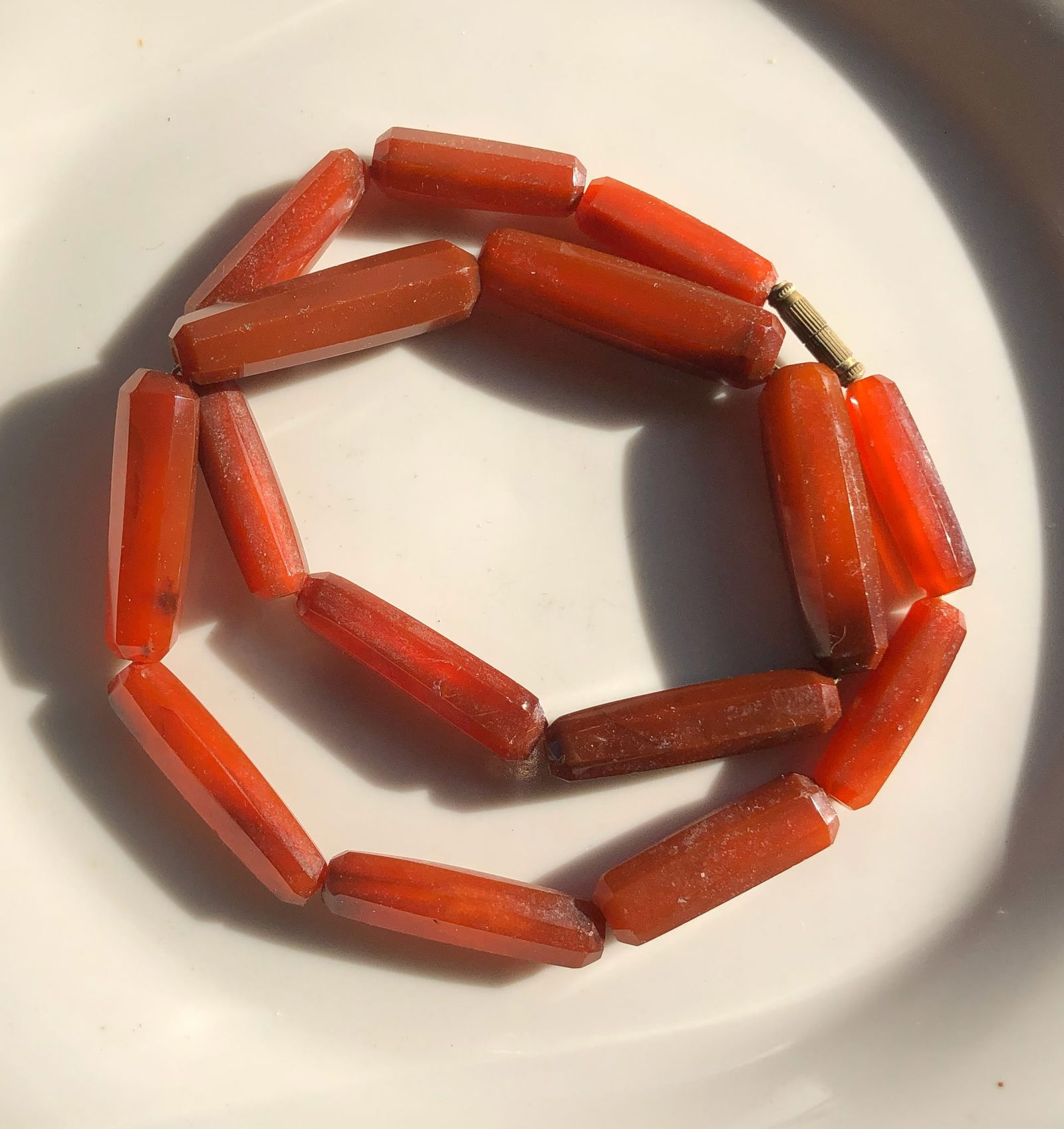 Red Carnelian Beaded Necklace: A beautiful red Carnelian beaded necklace with a simple clasp.