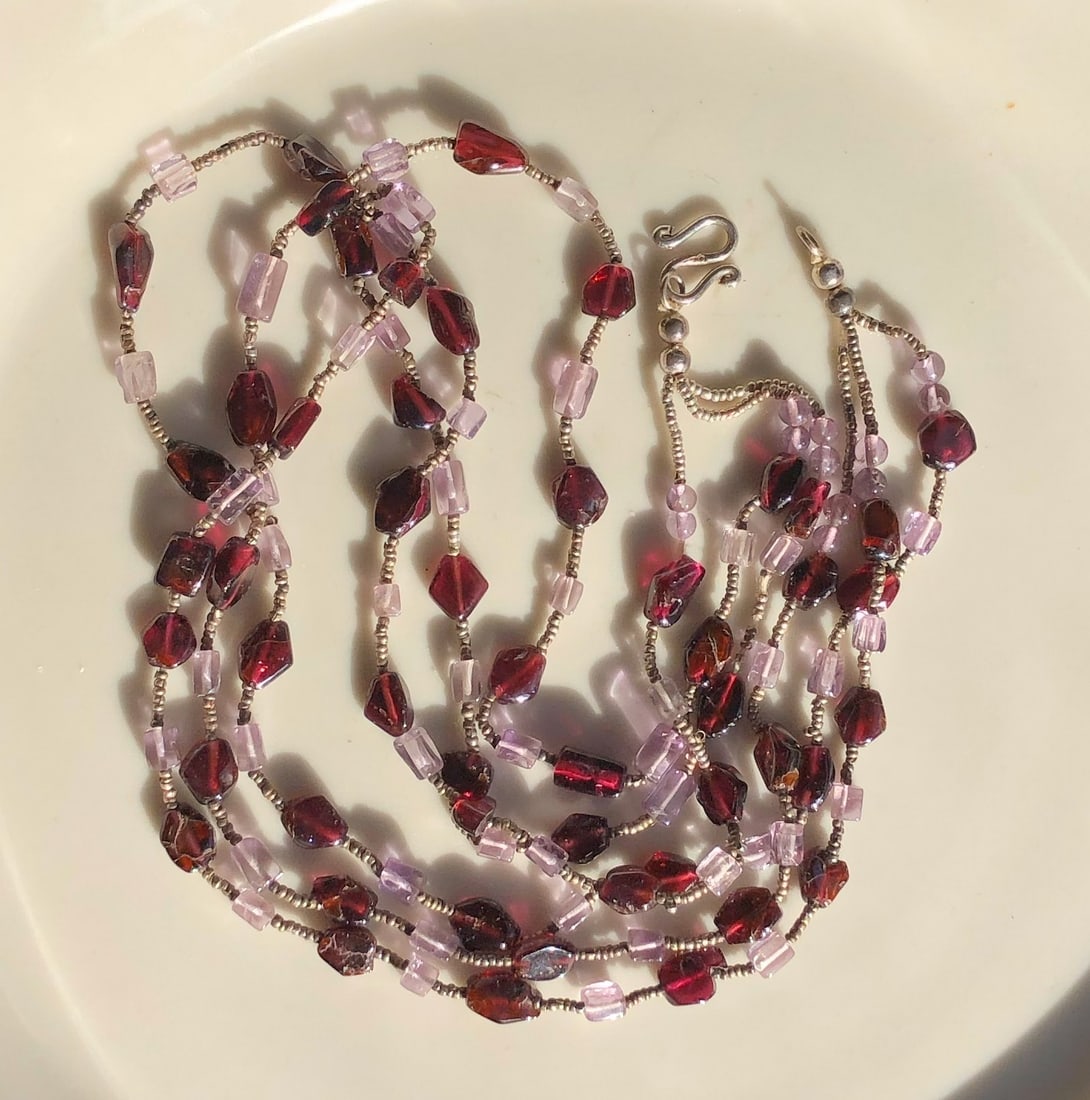 Beaded Silver Necklace: A beautiful handcrafted beaded Silver necklace with red and pink beads.