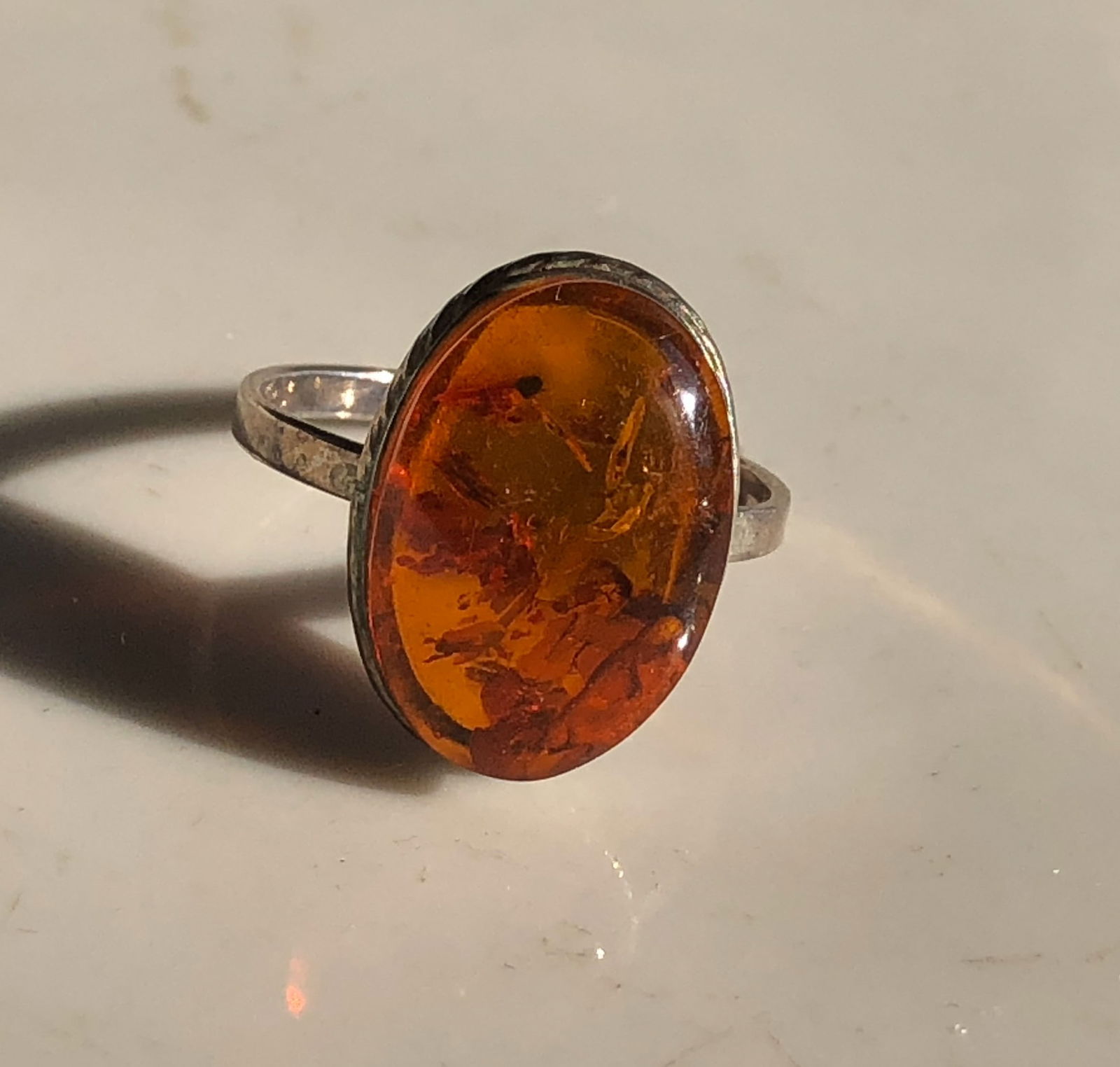 Amber Silver Ring: A beautiful amber silver ring set in a silver band. Size 8.