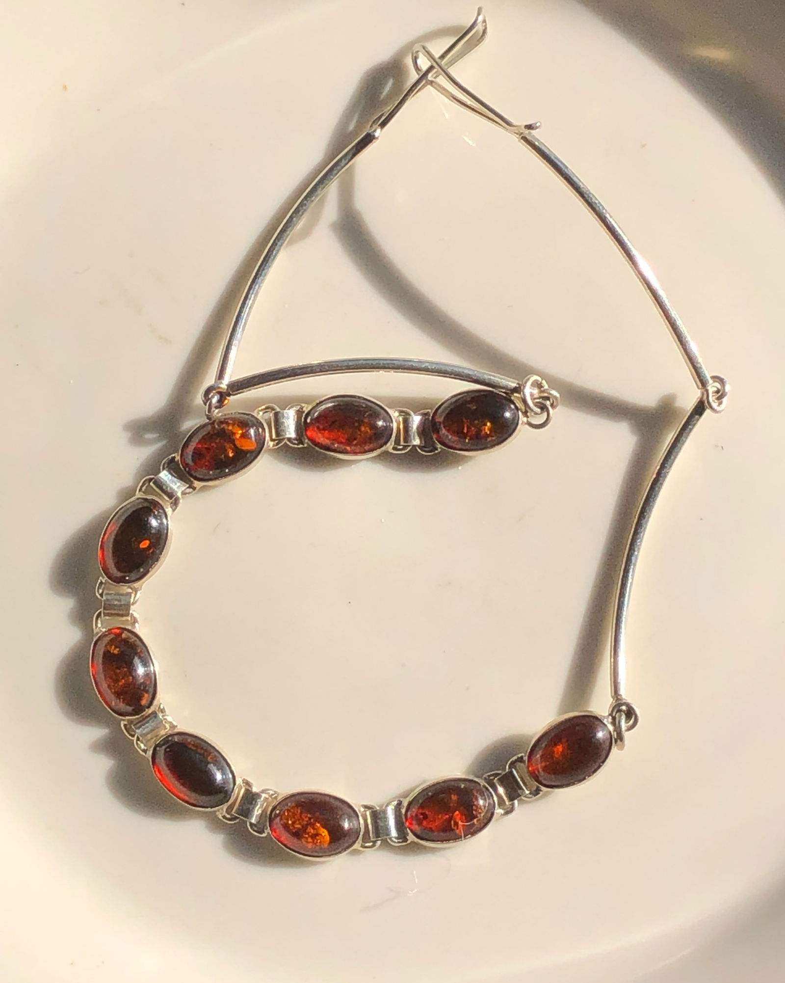 Amber and Silver Necklace: Elegant necklace featuring amber stones set in silver.