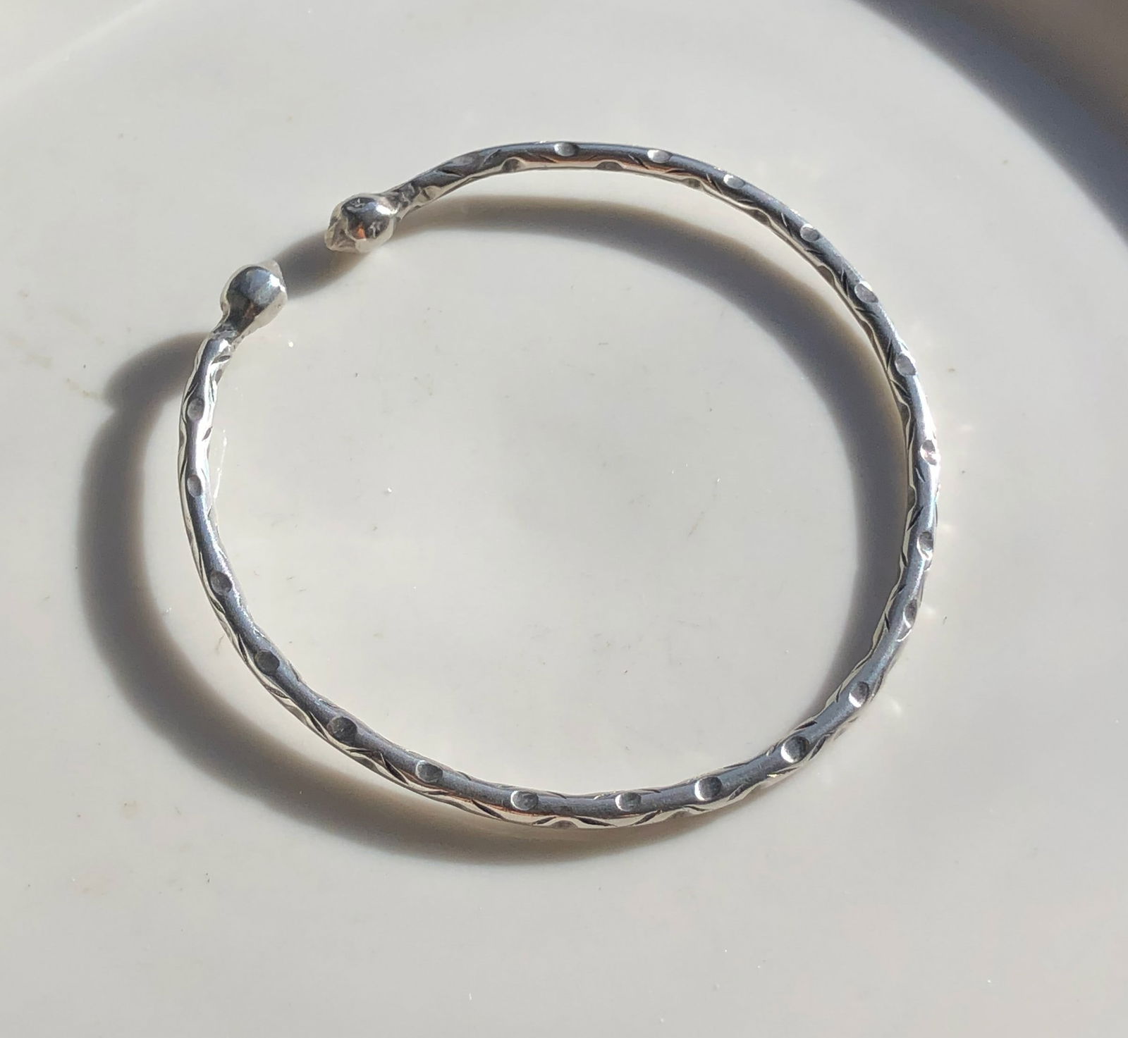 Silver Bangle Bracelet: Elegant silver bangle bracelet with a textured design. Weight 16g