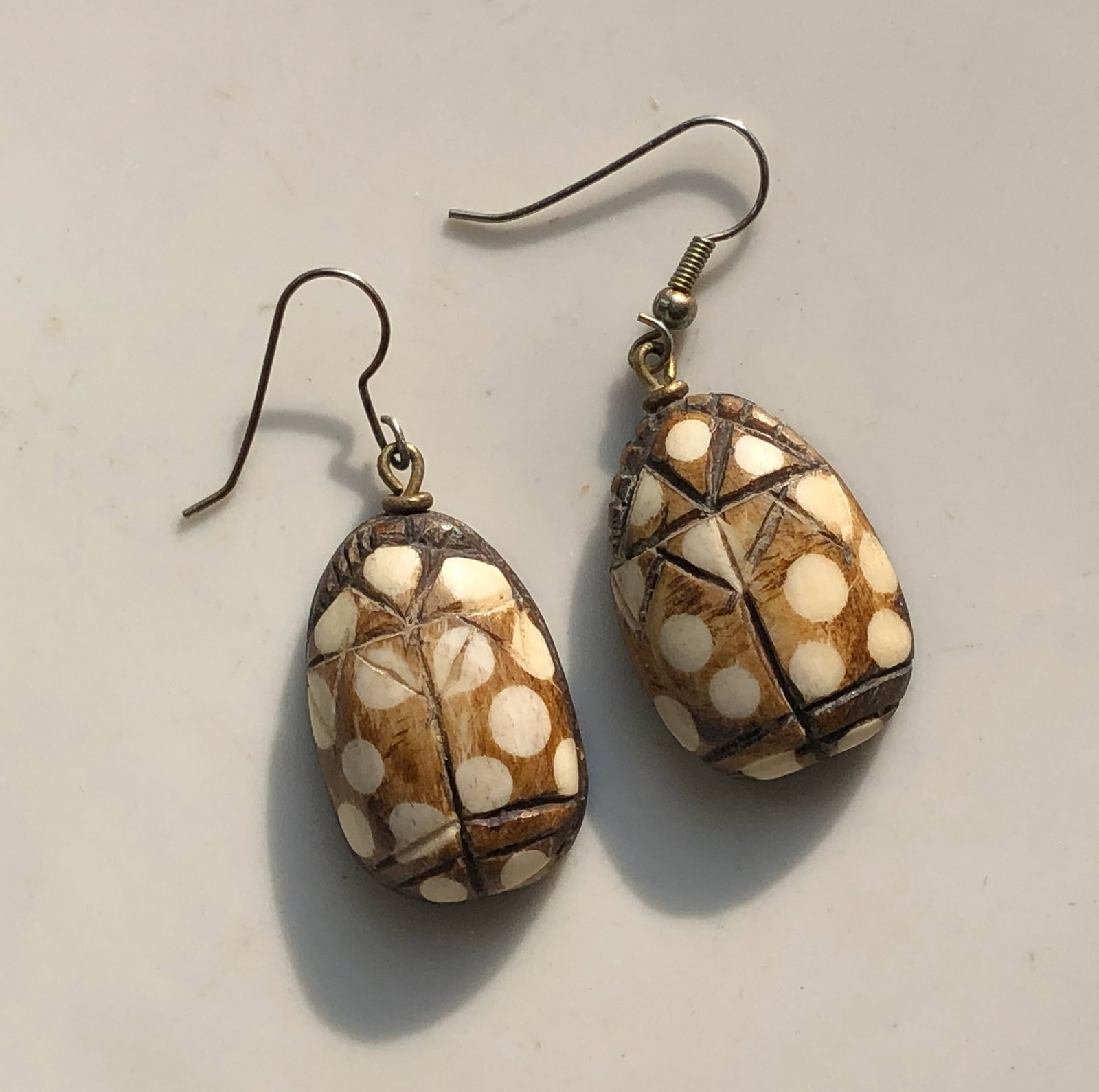 Polka Dot Bone Earrings: Handcrafted bone earrings with a polka dot design.