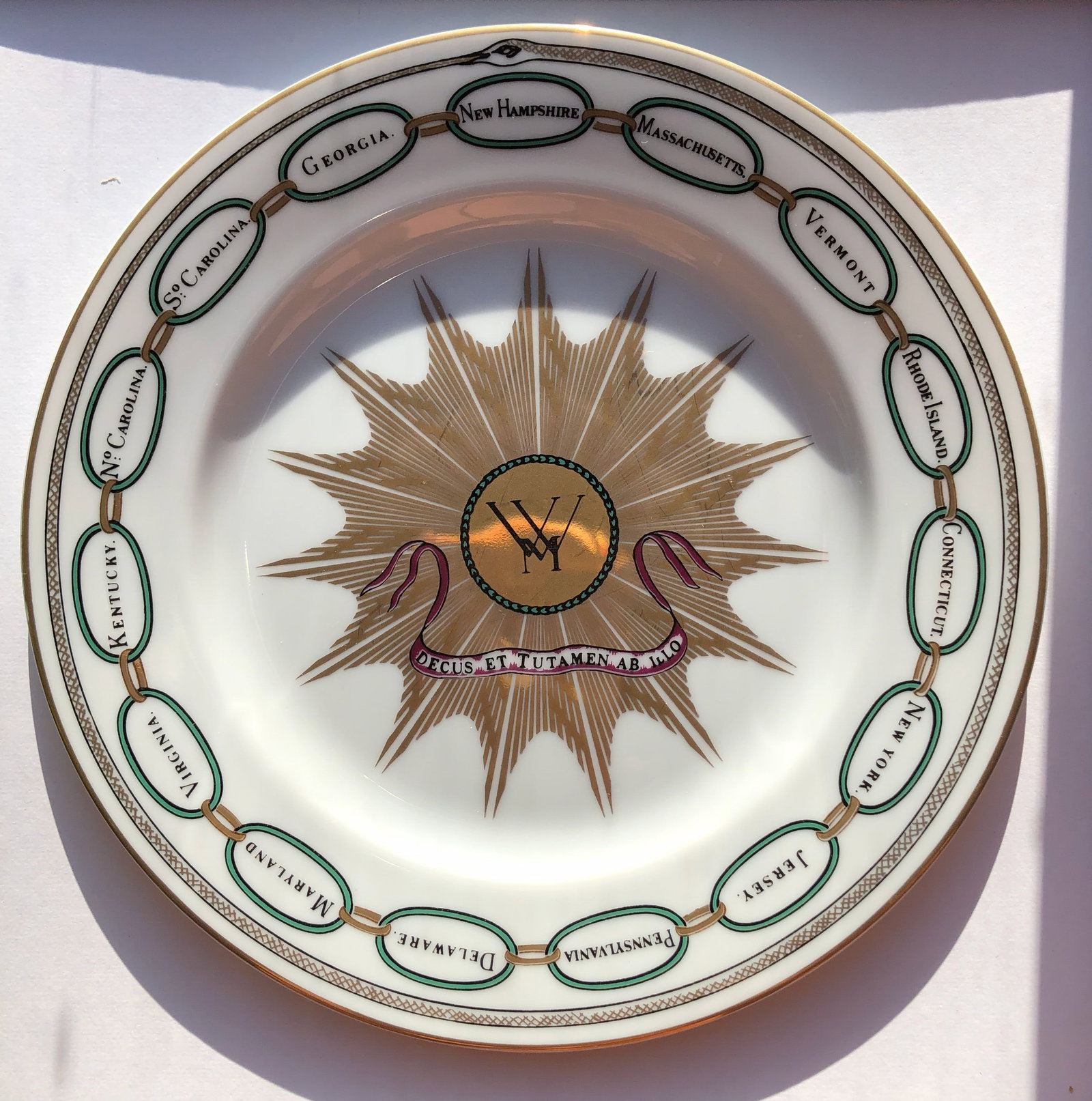 White house Desert Plate: A beautifully designed Whitehouse decorative plate with floral patterns and gold accents.