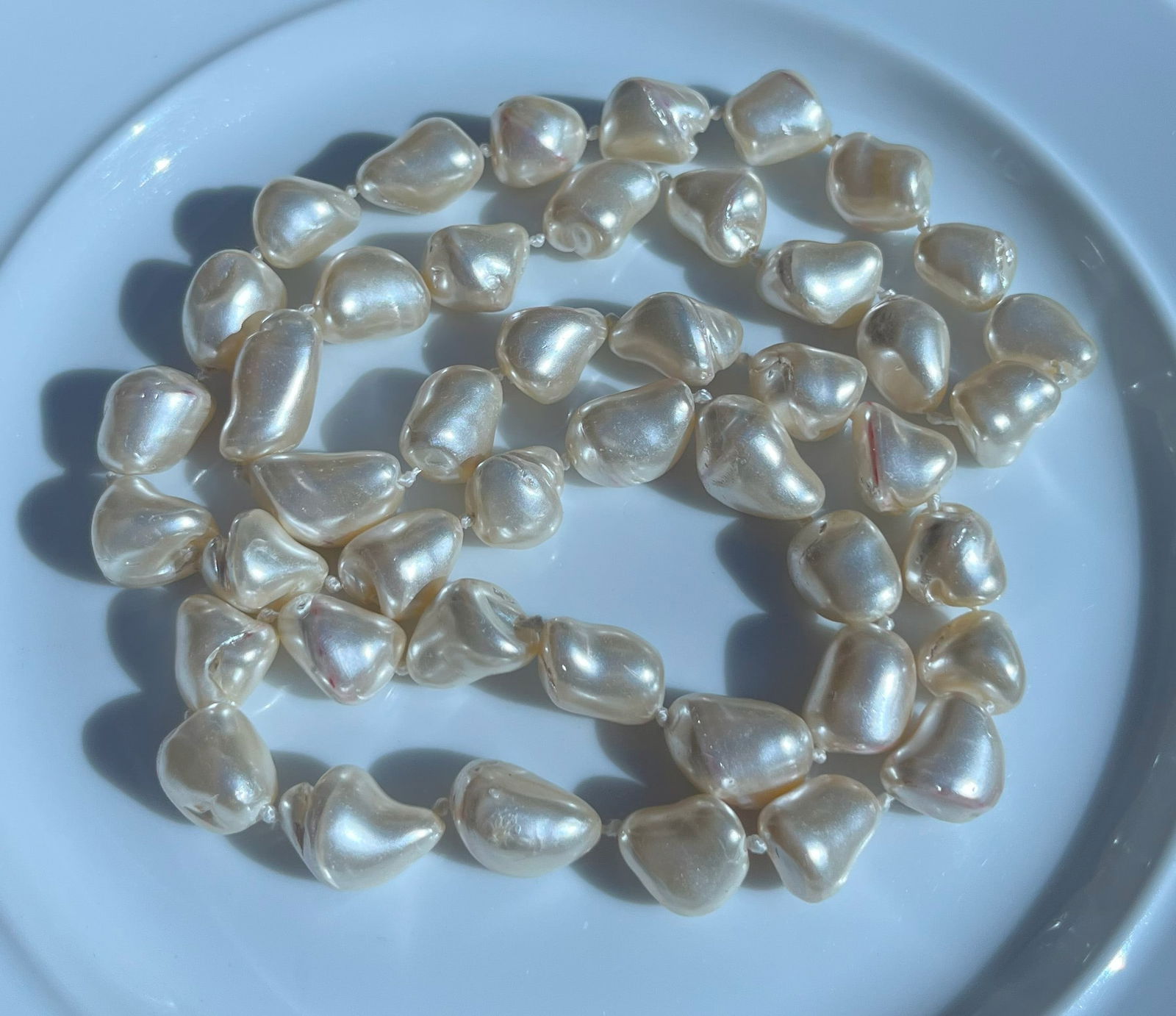 Baroque Faux Pearl Necklace: A stunning baroque faux pearl necklace with unique, irregularly shaped pearls.