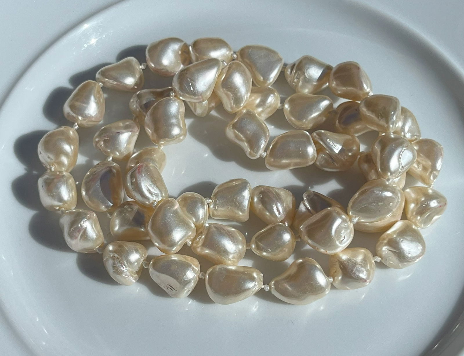 Baroque Faux Pearl Necklace: A stunning baroque faux pearl necklace with unique, irregularly shaped pearls.