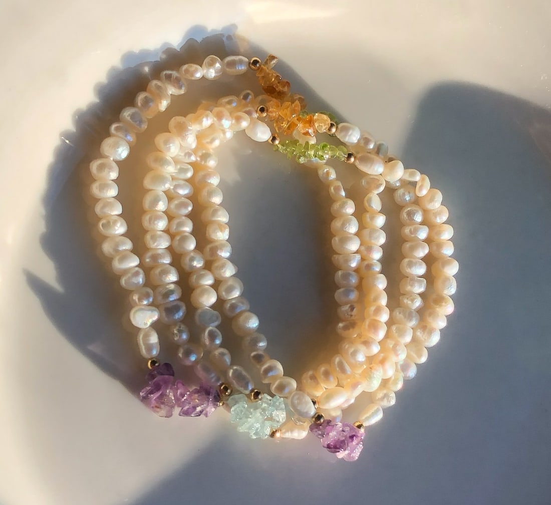 Vintage Pearl Necklace: Elegant pearl Necklace with colorful gemstone accents.