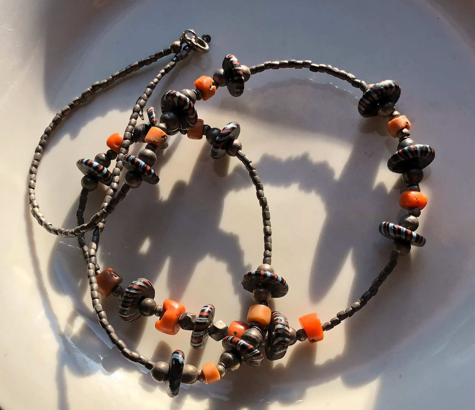 Silver and Coral Beaded Necklace: A handcrafted Silver and Coral beaded necklace with colorful beads, weight 37g.