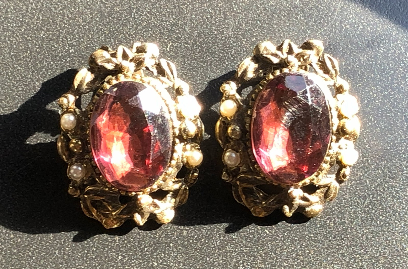 Vintage Earrings: Elegant vintage earrings with red gemstones and pearl accents.