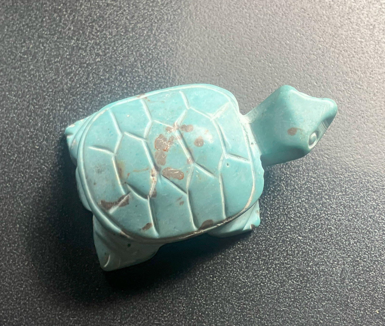 Turquoise Turtle Figurine: A small turquoise turtle figurine, perfect for decoration or as a collectible item.