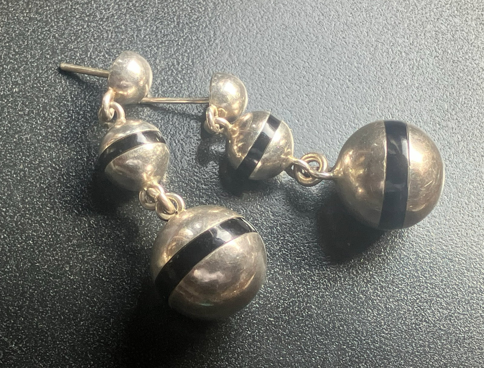 Silver and Black Striped Earrings: Elegant silver earrings with black stripes, perfect for any occasion.