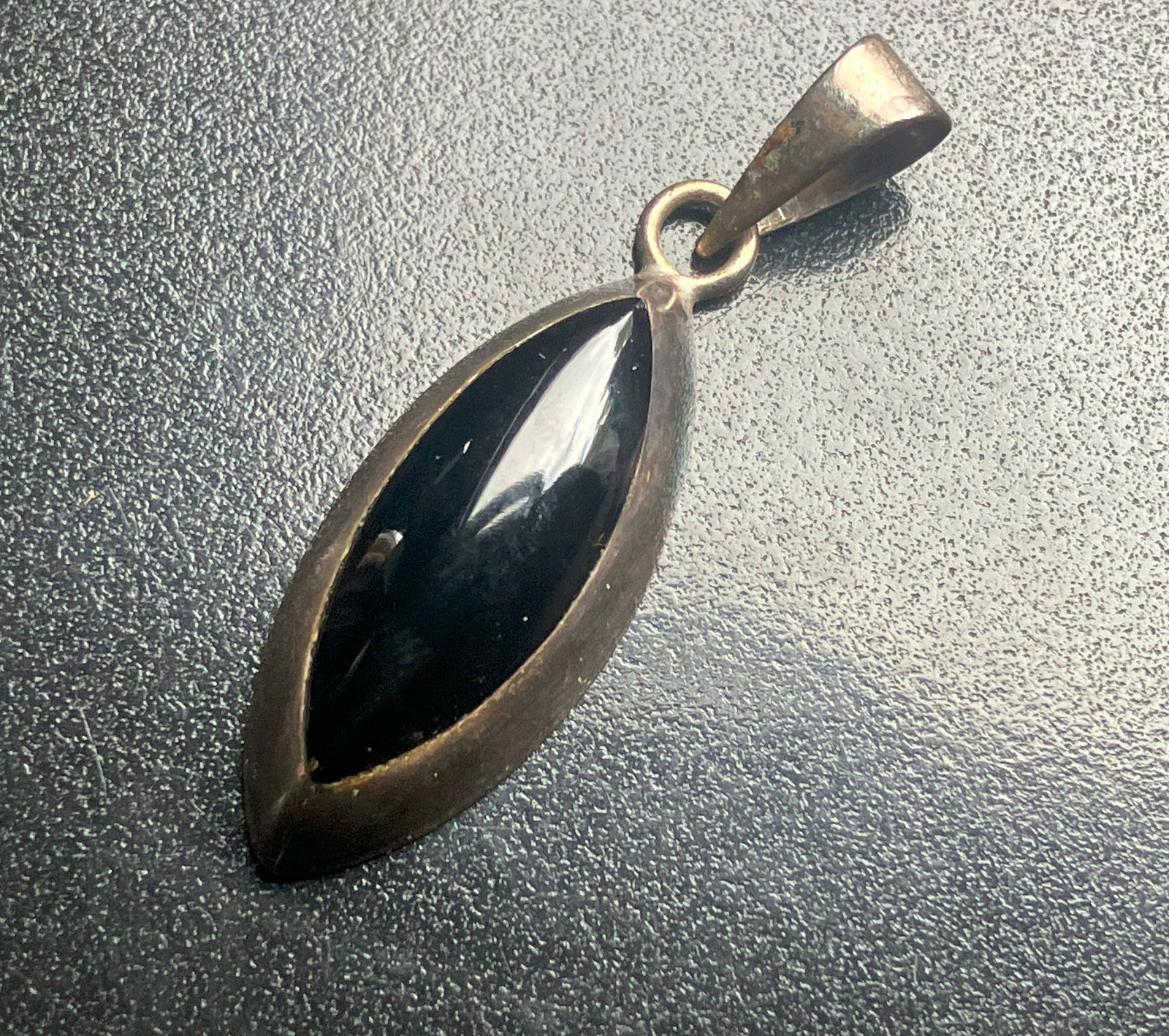 Black Onyx Silver Pendant: A sleek black Onyx pendant set in a silver frame, Size: 1.75".