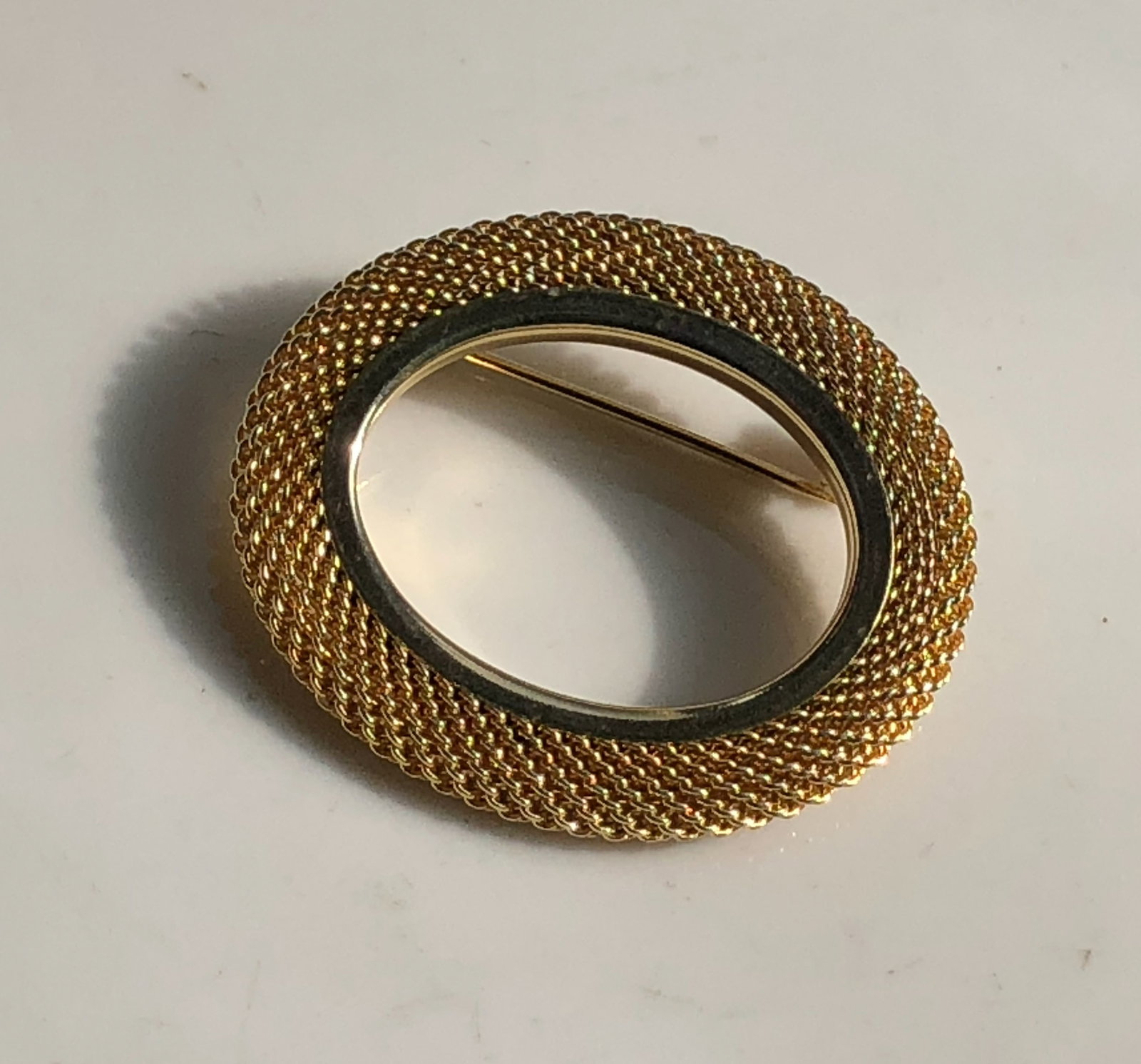 Gold Filled Brooch: Elegant gold Filled brooch with intricate design.