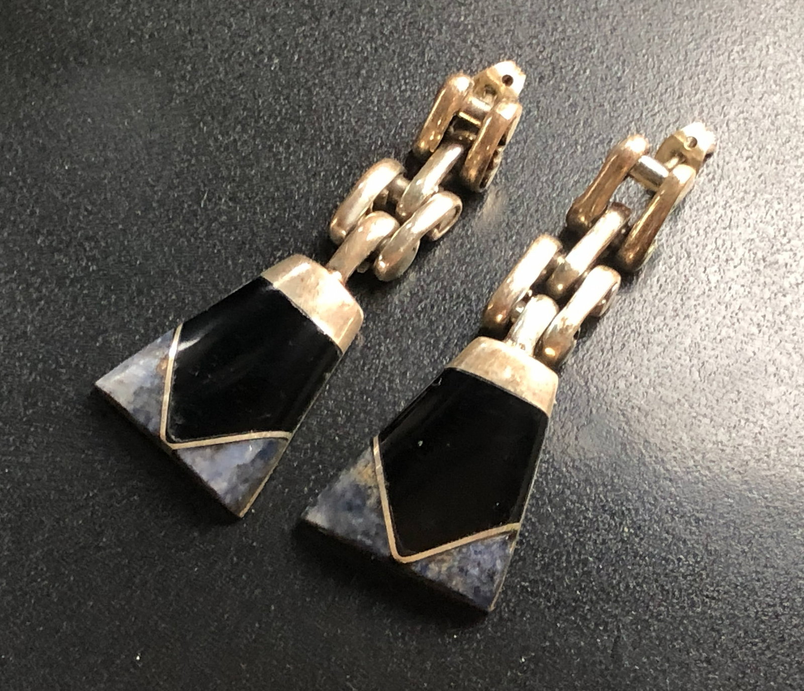 Silver Black Earrings: Elegant Silver black earrings with a unique design.