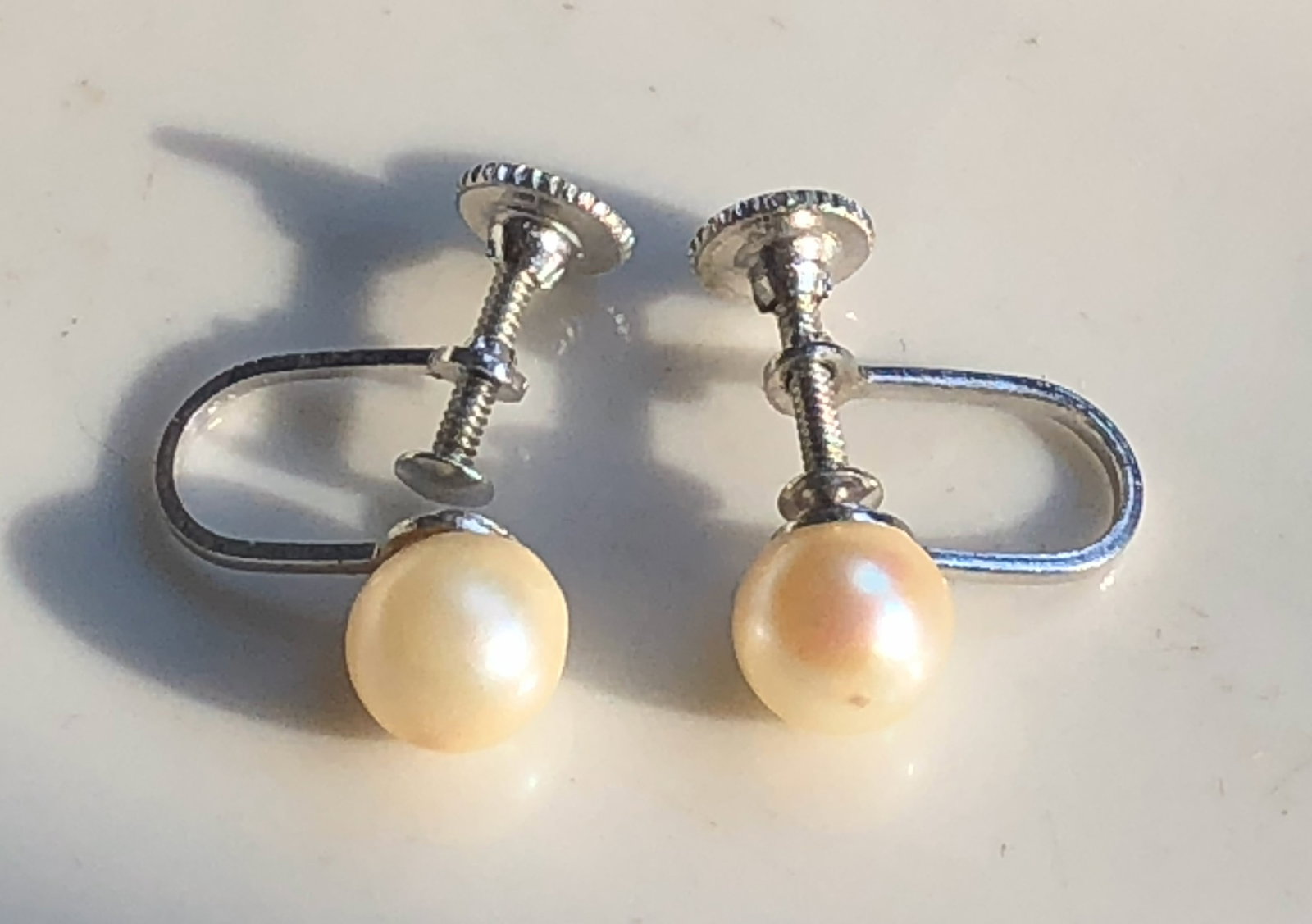 Sea Pearl Screw Back Silver Earrings: Elegant sea pearl screw back Silver earrings with a classic design.