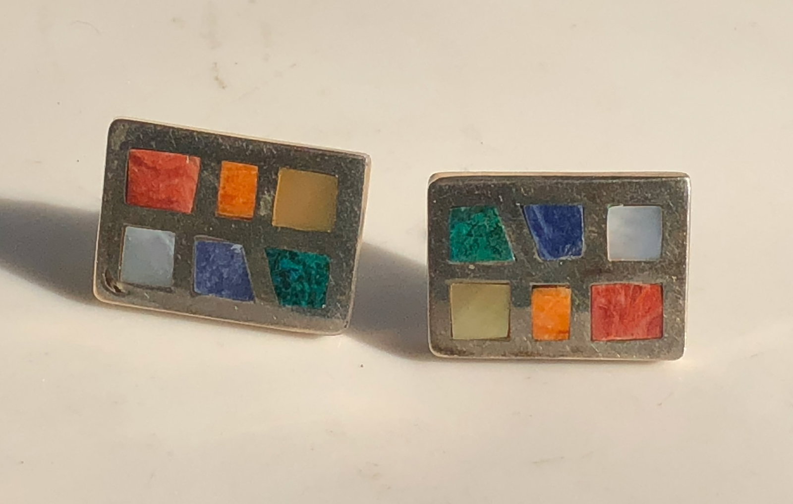Colorful Mosaic Silver Earrings: A pair of vibrant, colorful mosaic silver earrings with a unique geometric design.